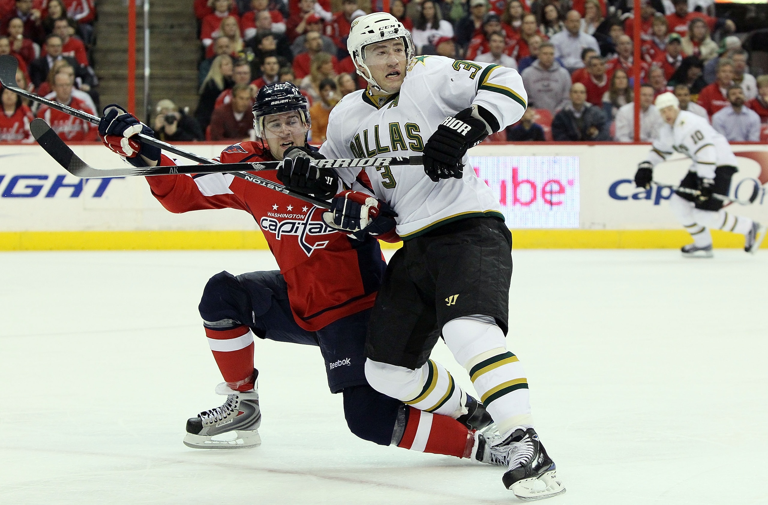 WASHINGTON - MARCH 08:  Mike Green #52 of the Washington Capitals defends against Stephane Robidas #3 of the Dallas Stars on March 8, 2010 at the Verizon Center in Washington, DC.  (Photo by Jim McIsaac/Getty Images)