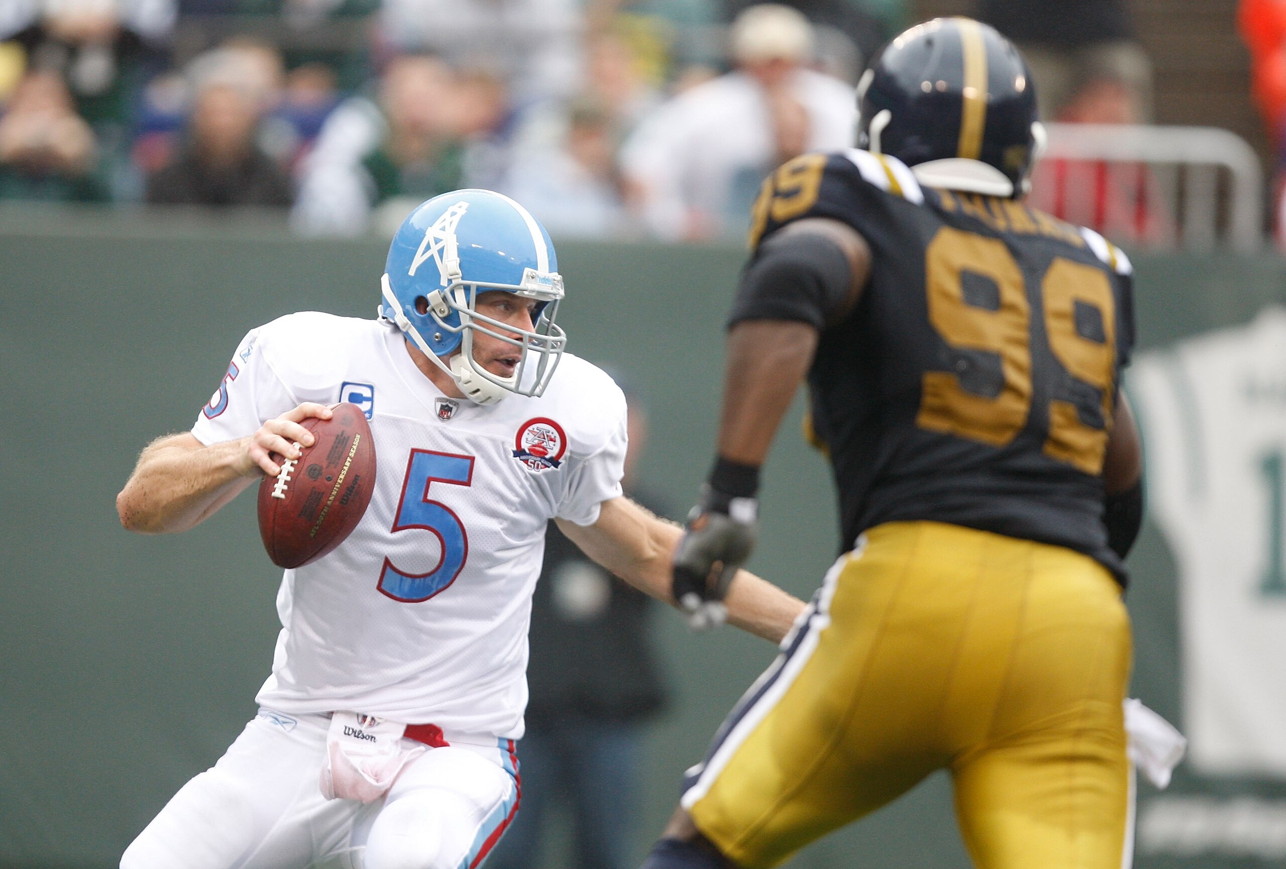 EAST RUTHERFORD, NJ - SEPTEMBER 27: Kerry Collins #5 of the Tennessee Titans drops back for a pass while Bryan Thomas #99 pursues him during the game on September 27, 2009 at Giants Stadium in East Rutherford, New Jersey. (Photo by Jared Wickerham/Getty I