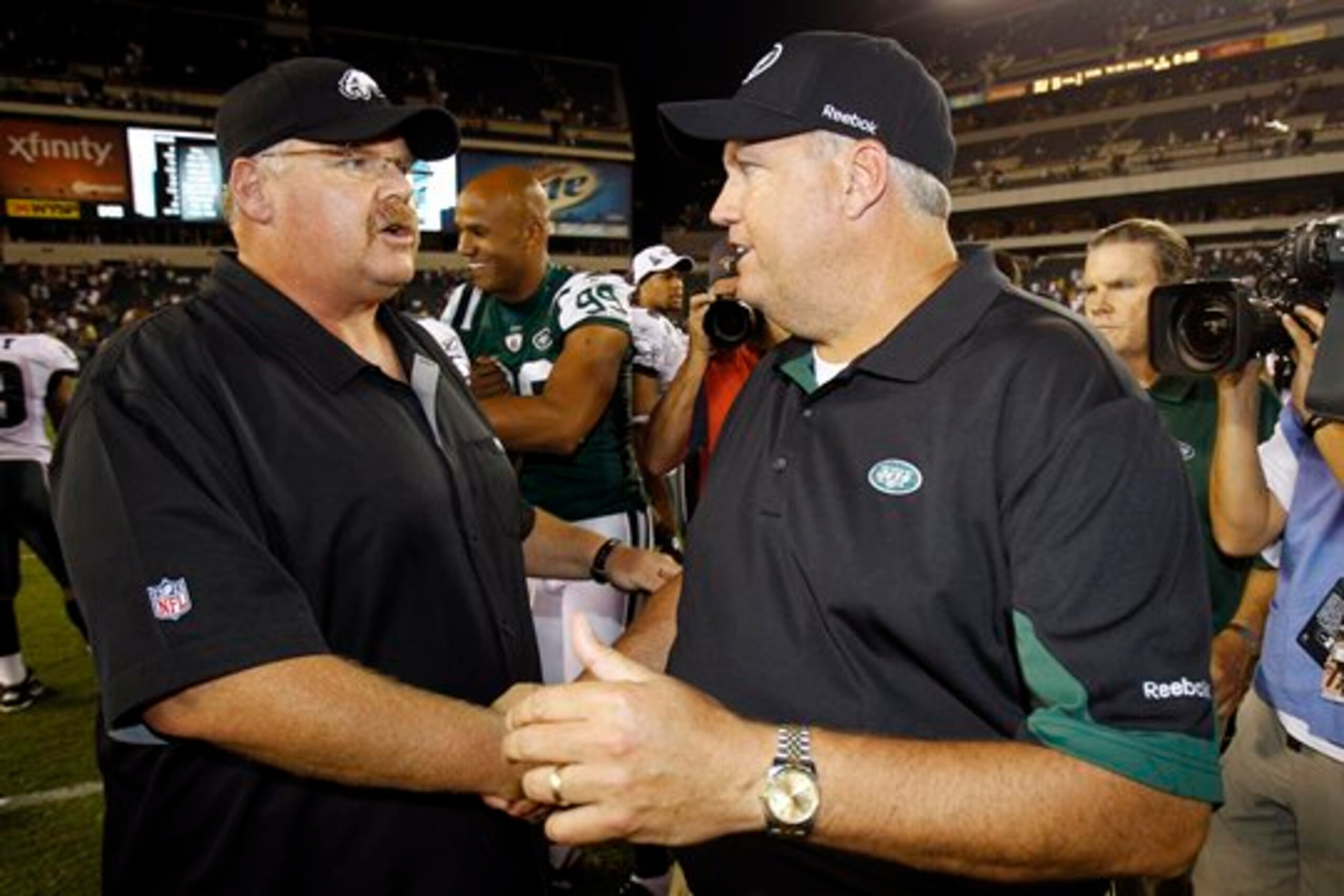 New York Jets' head coach Rex Ryan exchanges pleasantries with Philadelphia Eagles' head coach Andy Reid after New York defeated Philadelphia 21-17.