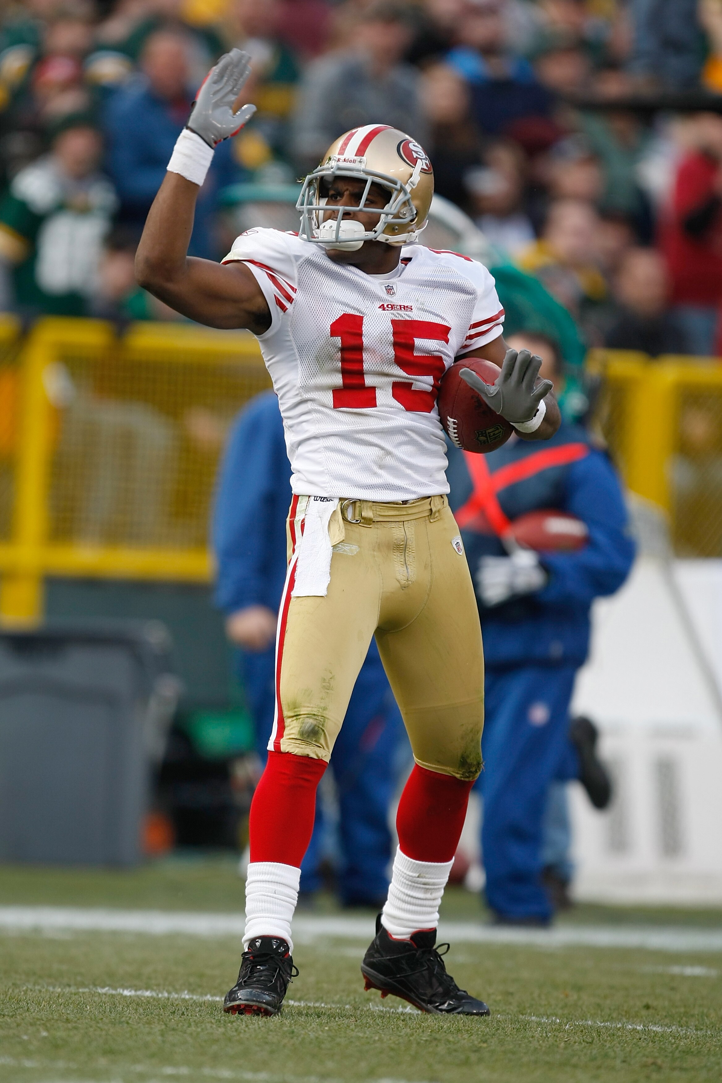 GREEN BAY, WI - NOVEMBER 22: Wide receiver Michael Crabtree #15 of the San Francisco 49ers signals a first down after a pas reception against the Green Bay Packers at Lambeau Field on November 22, 2009 in Green Bay, Wisconsin. The Packers defeated the 49e