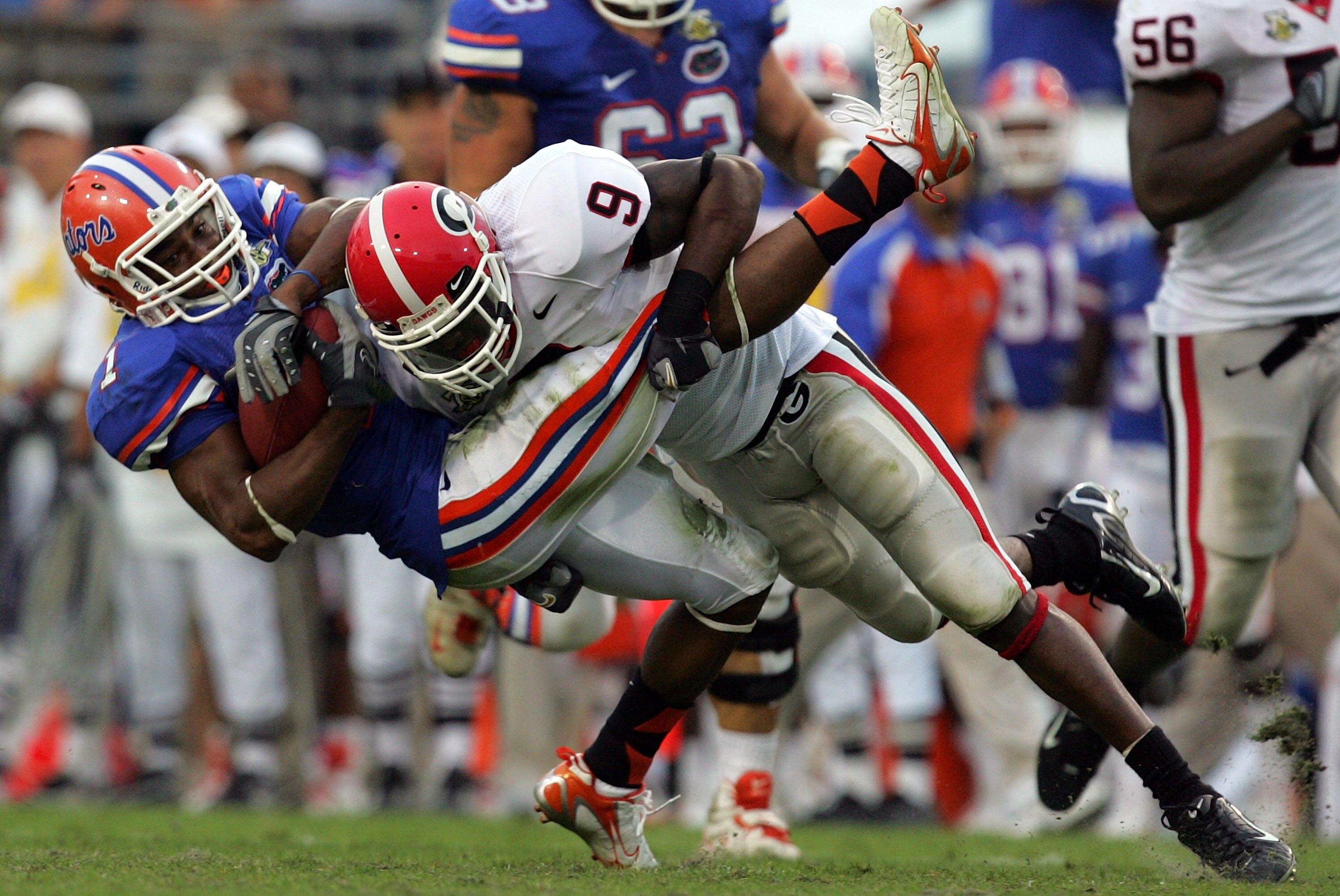 JACKSONVILLE, FL - OCTOBER 27:  Wide receiver Percy Harvin #1 of the Florida Gators is tackled by Reshad Jones #9 of the Georgia Bulldogs at Jacksonville Municipal Stadium on October 27, 2007 in Jacksonville, Florida.  (Photo by Ronald Martinez/Getty Imag