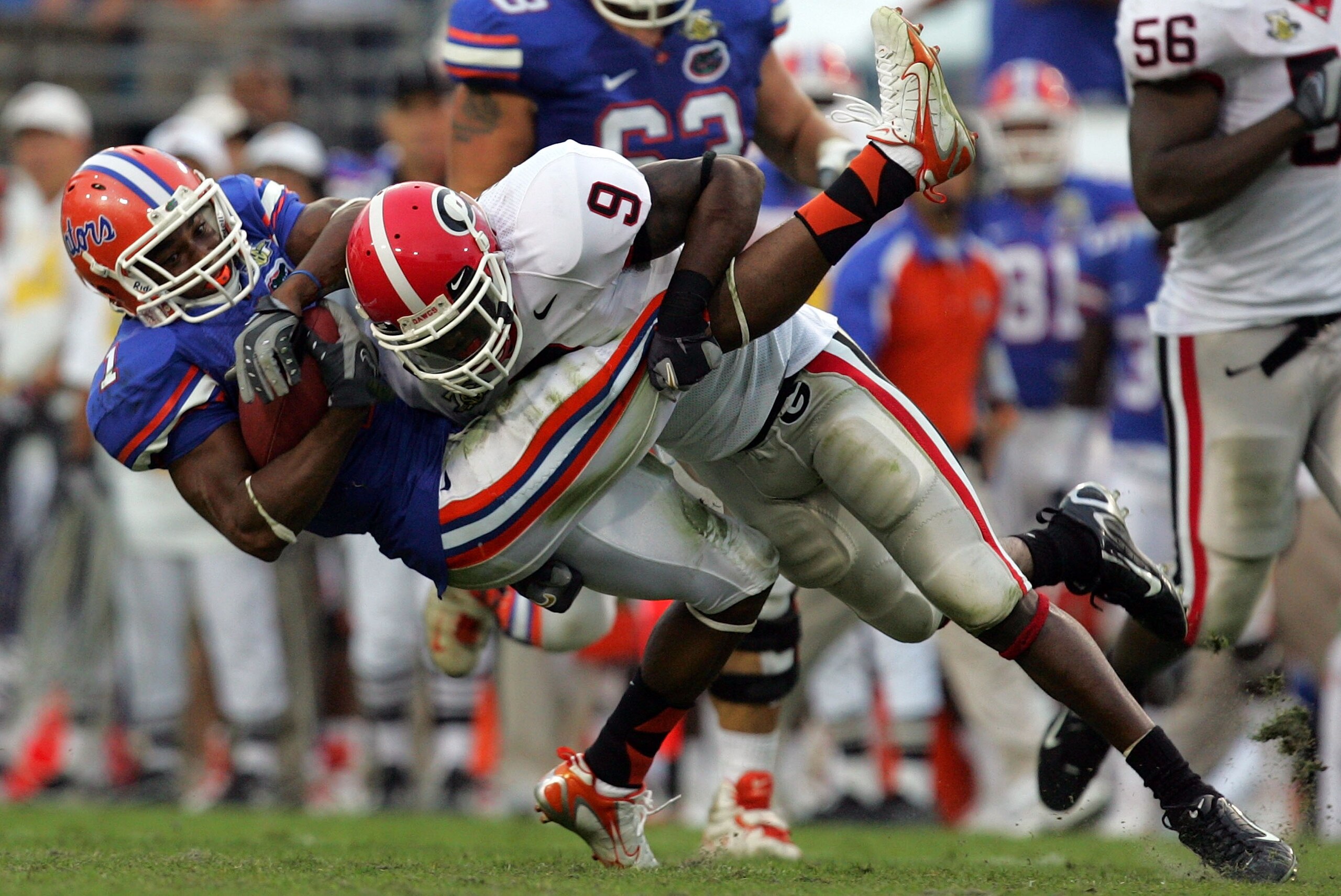 JACKSONVILLE, FL - OCTOBER 27:  Wide receiver Percy Harvin #1 of the Florida Gators is tackled by Reshad Jones #9 of the Georgia Bulldogs at Jacksonville Municipal Stadium on October 27, 2007 in Jacksonville, Florida.  (Photo by Ronald Martinez/Getty Imag