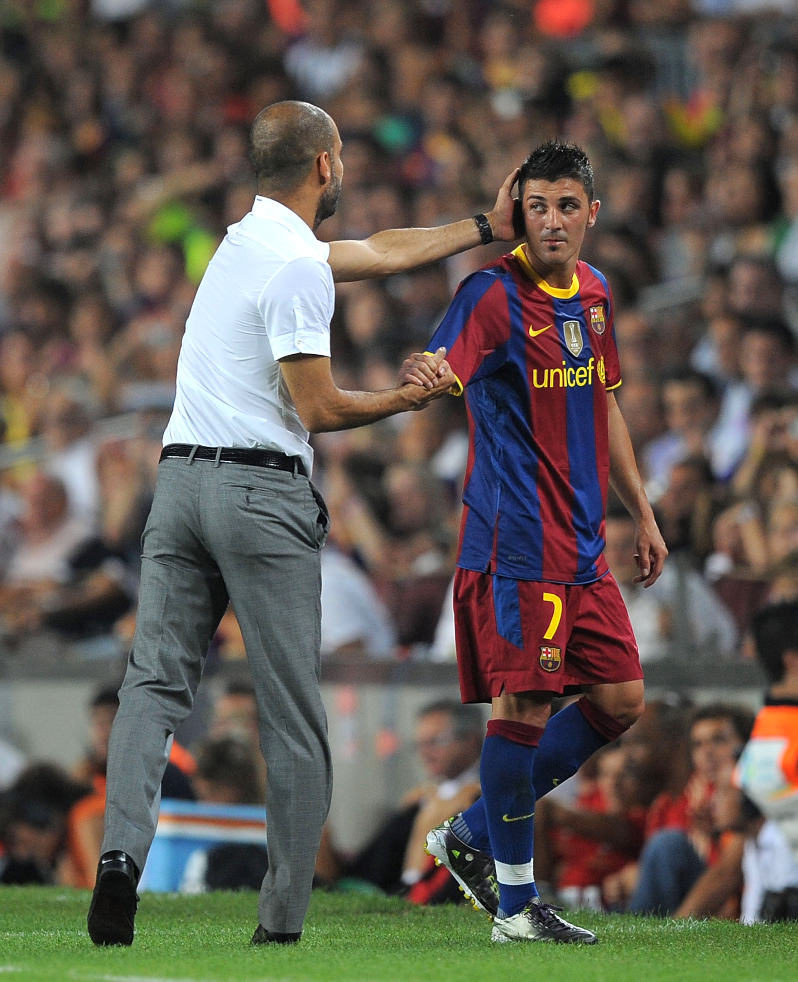BARCELONA, SPAIN - AUGUST 25: David Villa of Barcelona is congratulated by Barcelona manager Josep Guardiola after he was substituted during the Joan Gamper Trophy match between Barcelona and AC Milan at Camp Nou stadium on August 25, 2010 in Barcelona, BARCELONA, SPAIN - AUGUST 25: David Villa of Barcelona is congratulated by Barcelona manager Josep Guardiola after he was substituted during the Joan Gamper Trophy match between Barcelona and AC Milan at Camp Nou stadium on August 25, 2010 in Barcelona,
