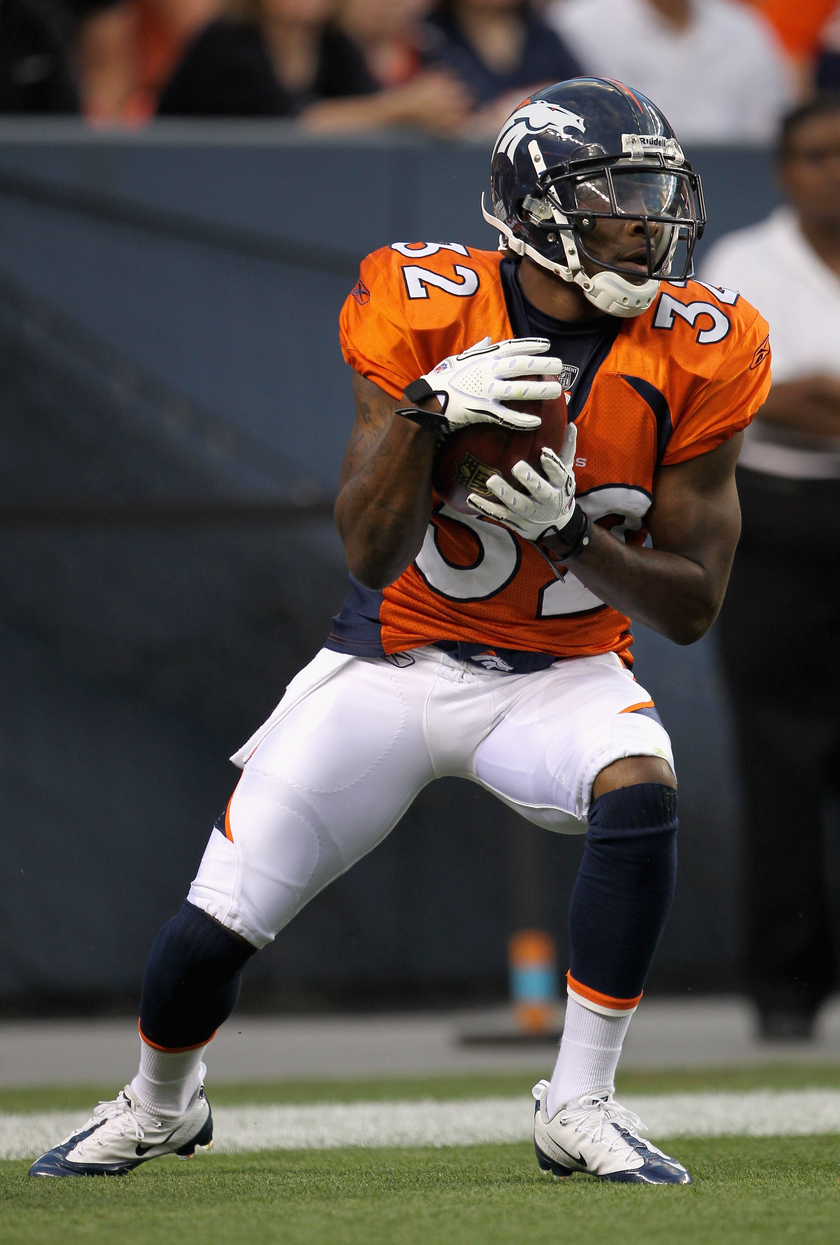 DENVER - AUGUST 21:  Perrish Cox #32 of the Denver Broncos receives a kick off against the Detroit Lions during preseason NFL action at INVESCO Field at Mile High on August 21, 2010 in Denver, Colorado. The Lions defeated the Broncos 25-20.  (Photo by Dou