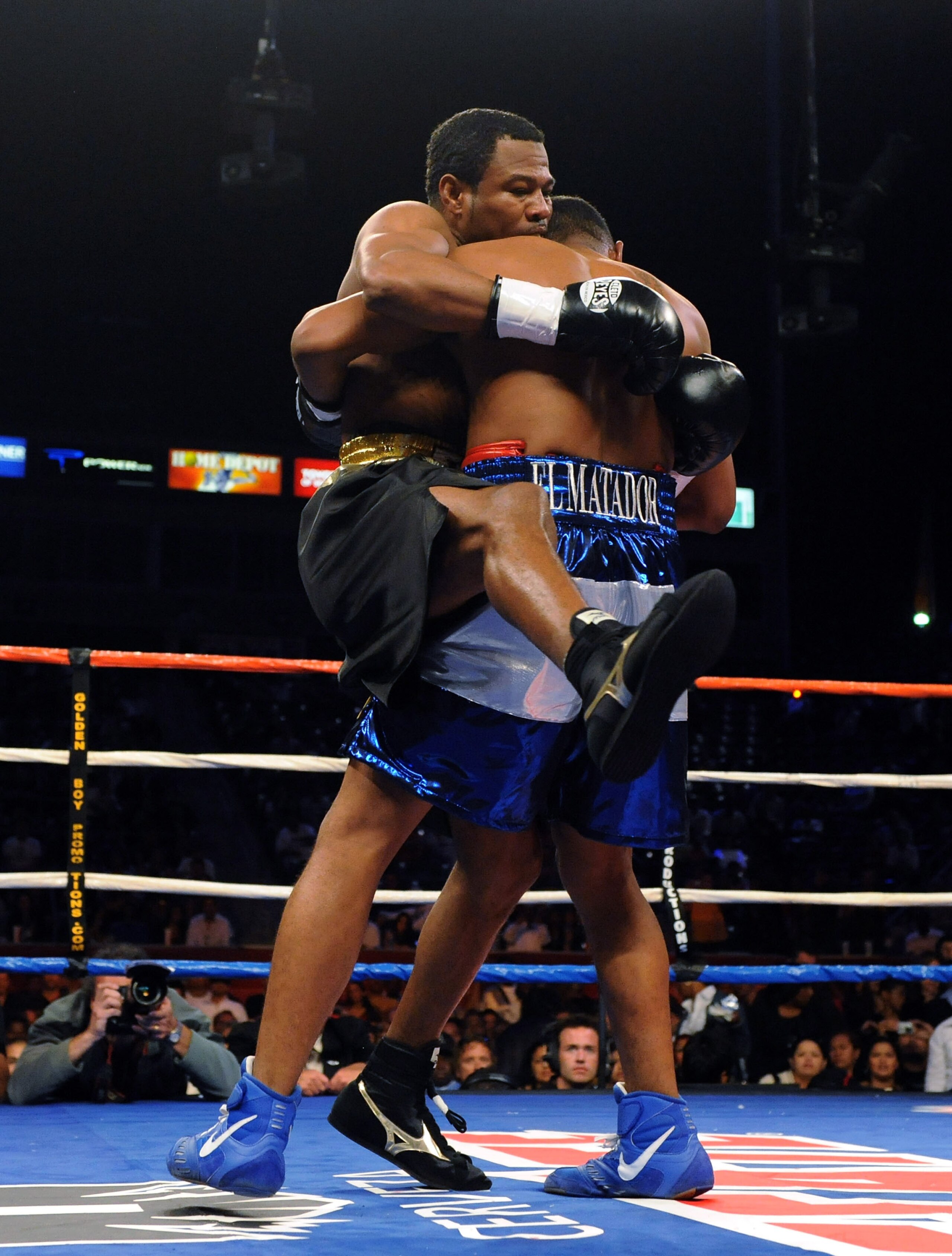 CARSON, CA - SEPTEMBER 27:  Shane Mosley is lifted up by Ricardo Mayorga of Nicaragua in the first round during their junior middleweight bout at the Home Depot Center on September 27, 2008 in Carson, California.  (Photo by Harry How/Getty Images)