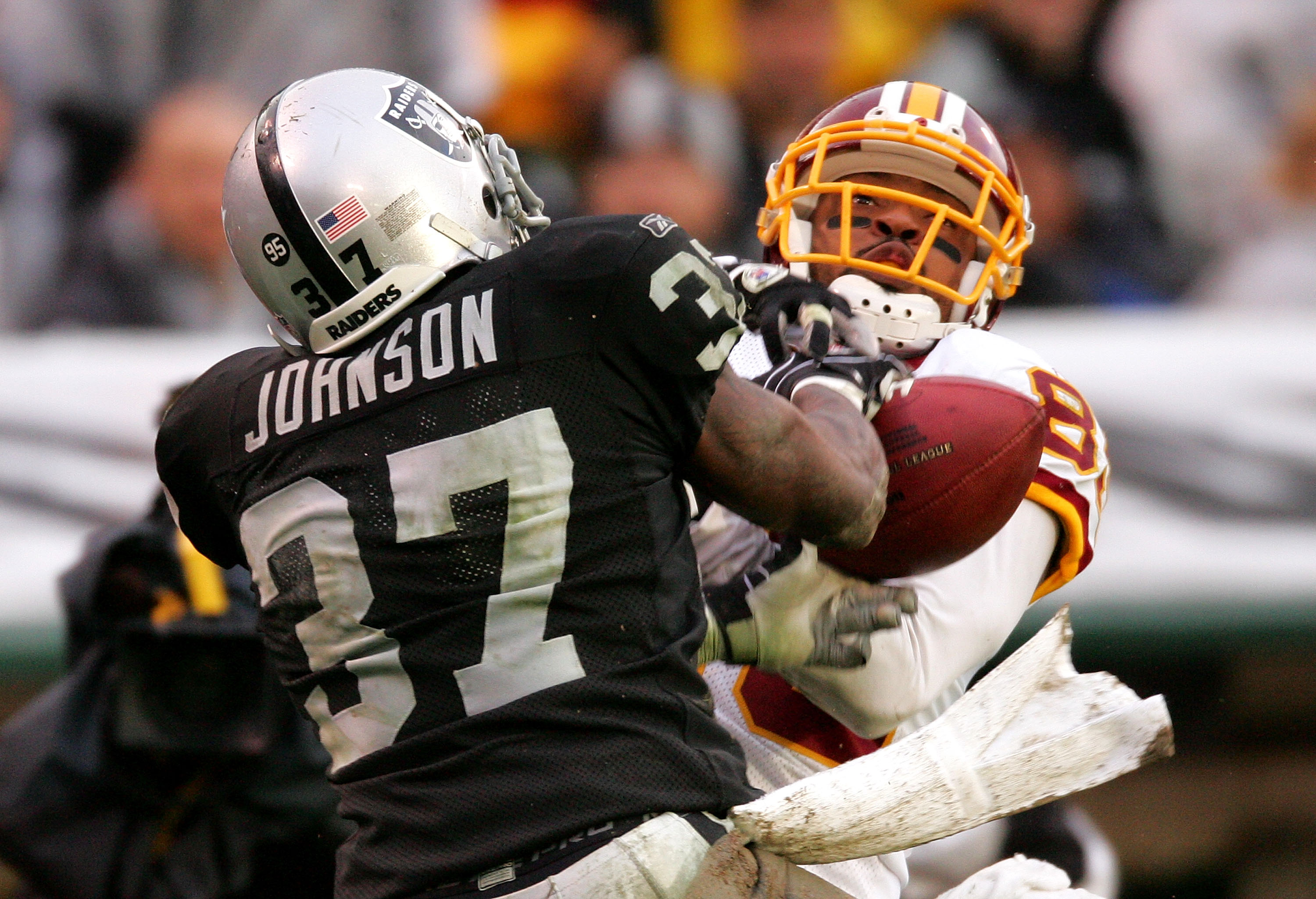 OAKLAND, CA - DECEMBER 13: Chris Johnson #37 of the Oakland Raiders breaks up a pass intended for Santana Moss #89 of the Washington Redskins at Oakland-Alameda County Coliseum on December 13, 2009 in Oakland, California. (Photo by Ezra Shaw/Getty Image OAKLAND, CA - DECEMBER 13: Chris Johnson #37 of the Oakland Raiders breaks up a pass intended for Santana Moss #89 of the Washington Redskins at Oakland-Alameda County Coliseum on December 13, 2009 in Oakland, California. (Photo by Ezra Shaw/Getty Image