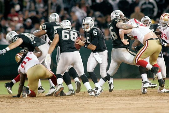 No. 68, Jared Veldheer works to protect QB Bruce Gradkowski.
