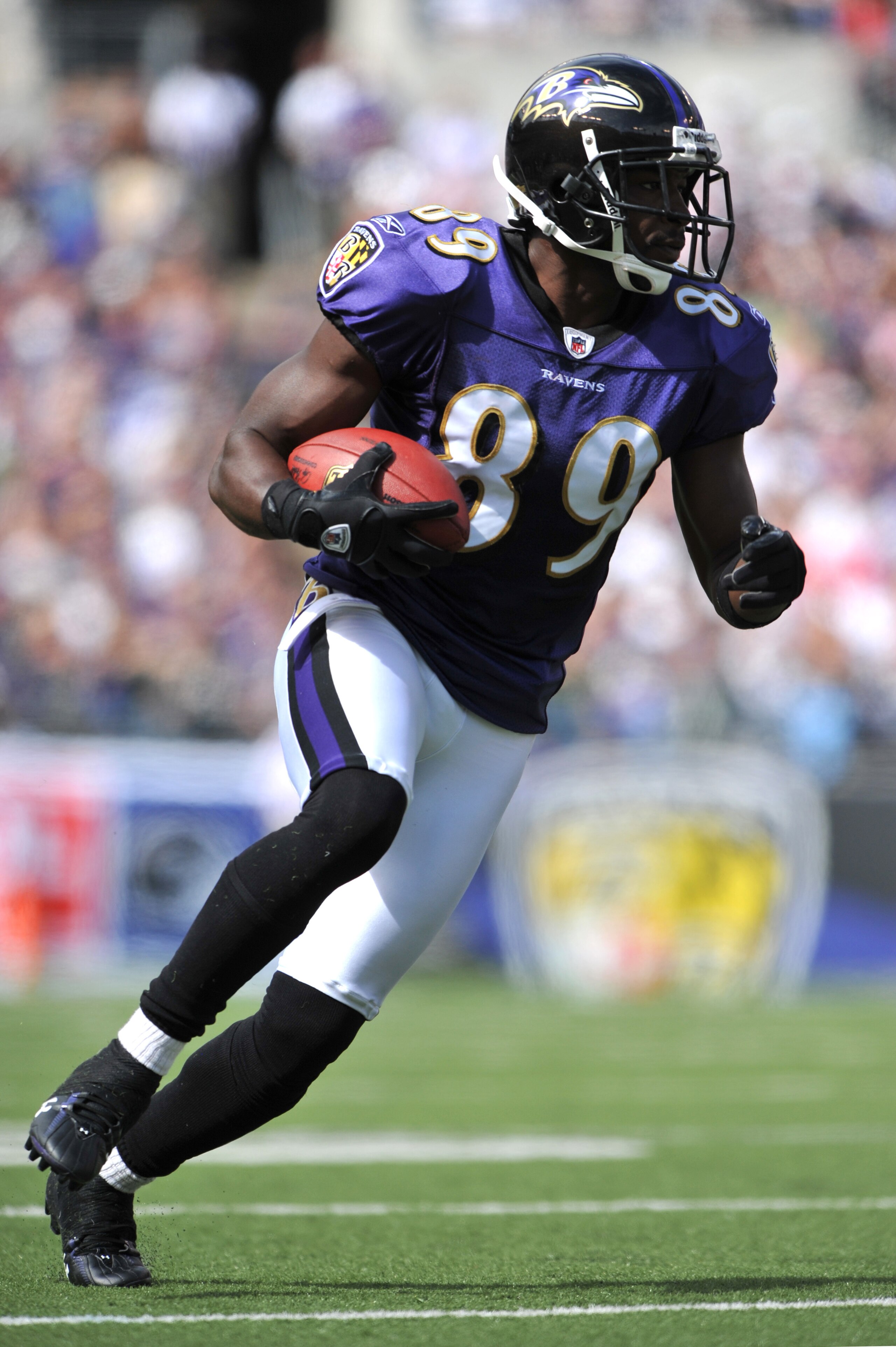 BALTIMORE - SEPTEMBER 27:  Mark Clayton #89 of the Baltimore Ravens runs the ball against the Cleveland Browns at M&T Bank Stadium on September 27, 2009 in Baltimore, Maryland. The Ravens defeated the Browns 34-3. (Photo by Larry French/Getty Images)