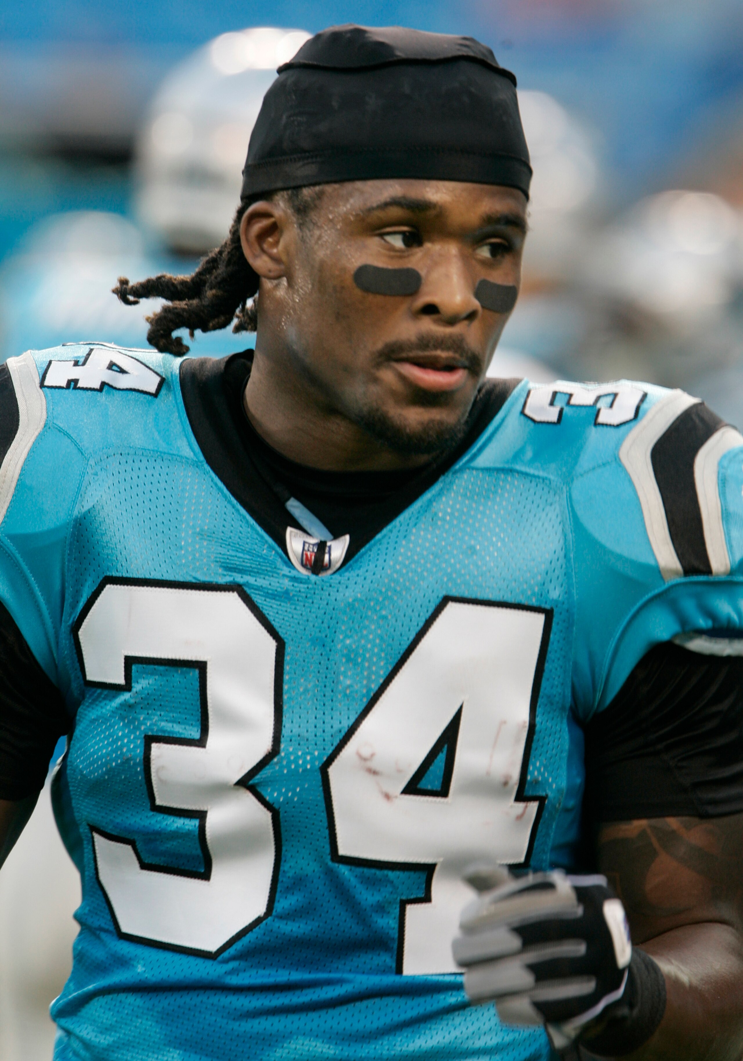 CHARLOTTE, NC - AUGUST 28:  Runningback DeAngelo Williams #34 of the Carolina Panthers leaves the field after warm-ups before the start of their preseason game against the Tennessee Titans at Bank of America Stadium on August 28, 2010 in Charlotte, North