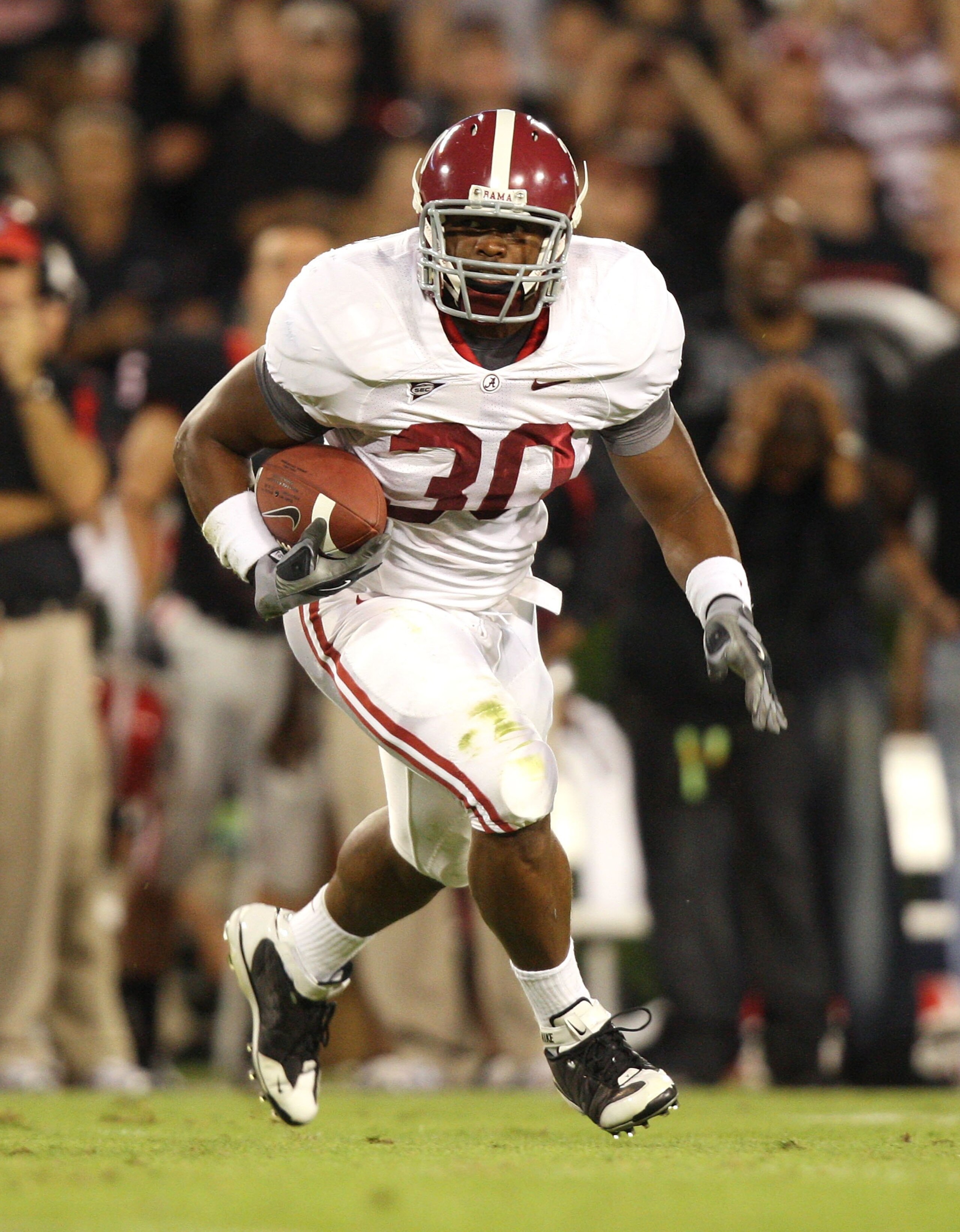 ATHENS, GA - SEPTEMBER 27:  Running back Donta Hightower #30 of the Alabama Crimson Tide looks for room to run while taking on the Georgia Bulldogs at Sanford Stadium on September 27, 2008 in Athens, Georgia. Alabama defeated Georgia 41-30.  (Photo by Dou