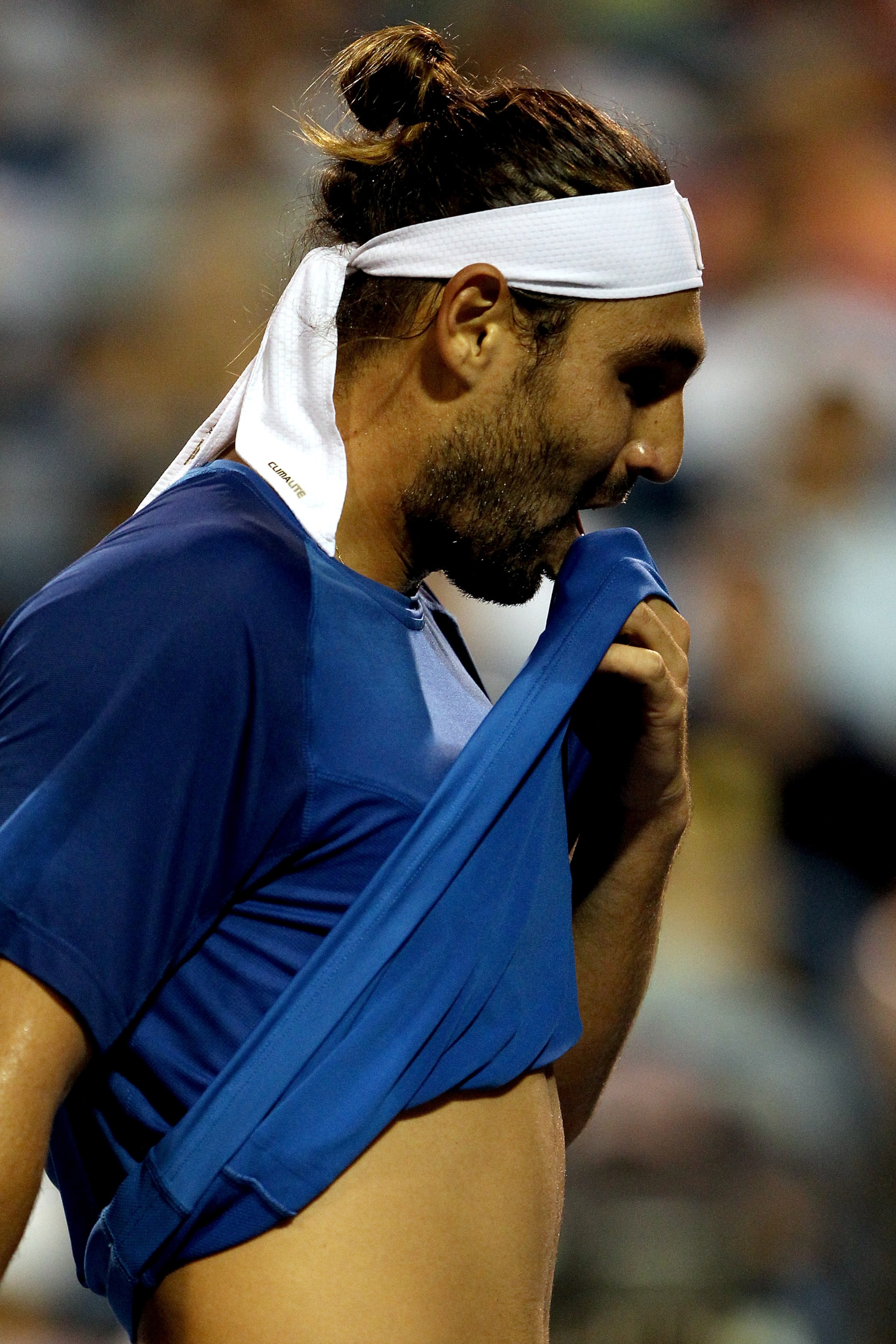 NEW HAVEN, CT - AUGUST 26: Marcos Baghdatis of Cypruswalks back to the baseline between points against Sergiy Stakhovsky of the Ukraine during the Pilot Pen tennis tournament at the Connecticut Tennis Center on August 26, 2010 in New Haven, Connecticut. NEW HAVEN, CT - AUGUST 26: Marcos Baghdatis of Cypruswalks back to the baseline between points against Sergiy Stakhovsky of the Ukraine during the Pilot Pen tennis tournament at the Connecticut Tennis Center on August 26, 2010 in New Haven, Connecticut.