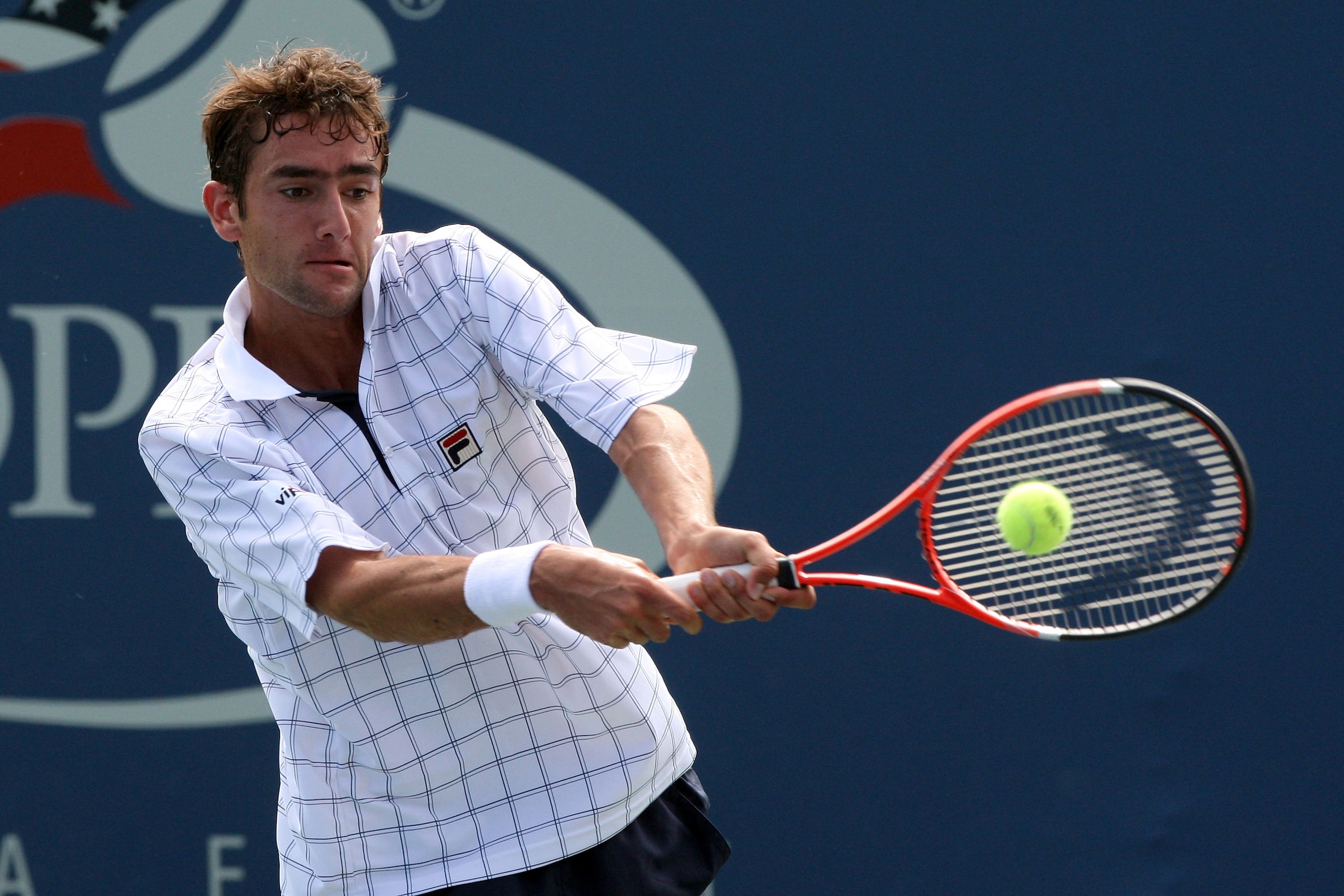 NEW YORK - SEPTEMBER 04: Marin Cilic of Croatia returns a shot against Jesse Levine during day five of the 2009 U.S. Open at the USTA Billie Jean King National Tennis Center on September 4, 2009 in the Flushing neighborhood of the Queens borough of New Y NEW YORK - SEPTEMBER 04: Marin Cilic of Croatia returns a shot against Jesse Levine during day five of the 2009 U.S. Open at the USTA Billie Jean King National Tennis Center on September 4, 2009 in the Flushing neighborhood of the Queens borough of New Y