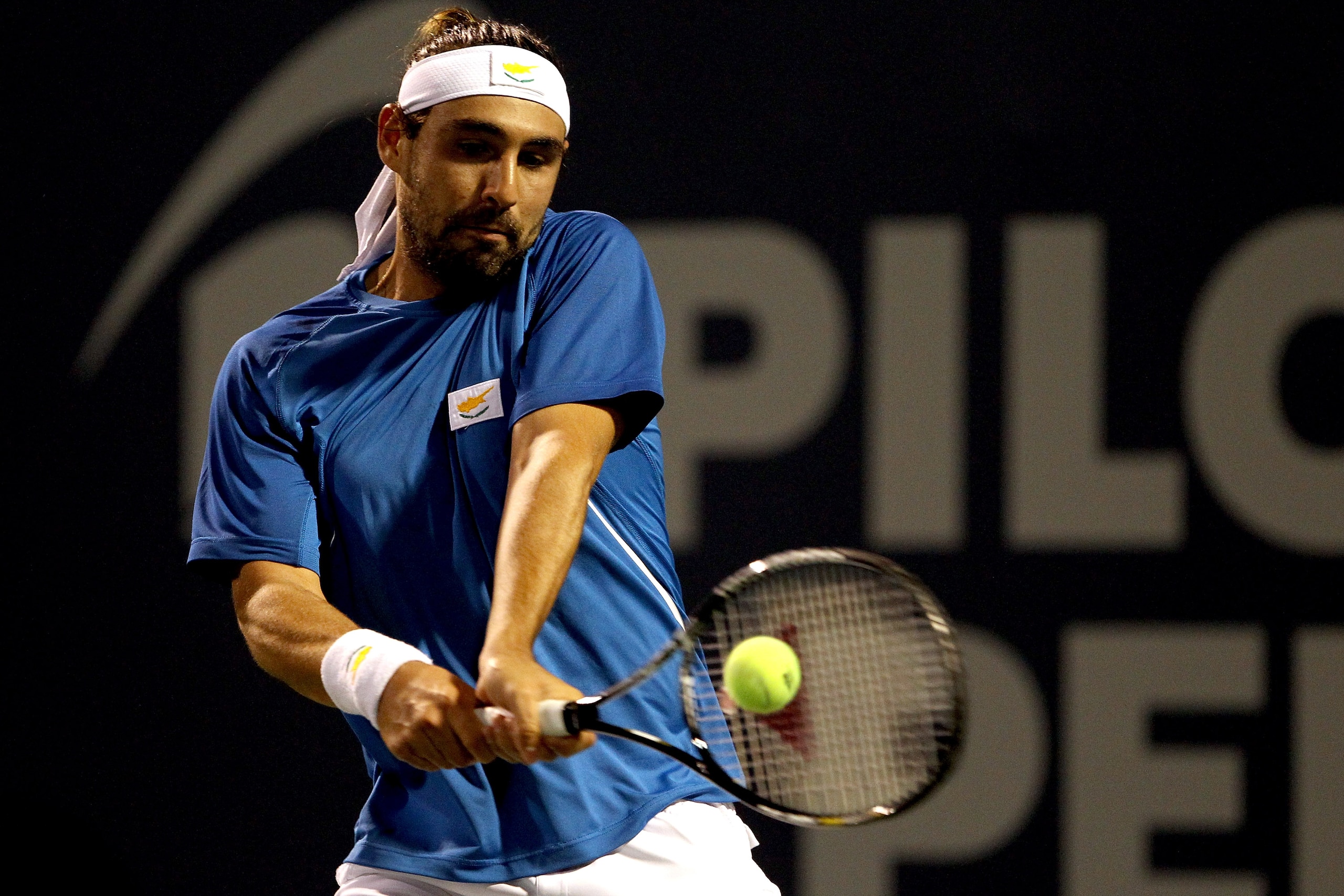 NEW HAVEN, CT - AUGUST 26: Marcos Baghdatis of Cyprus returns a shot to Sergiy Stakhovsky of the Ukraine during the Pilot Pen tennis tournament at the Connecticut Tennis Center on August 26, 2010 in New Haven, Connecticut. (Photo by Matthew Stockman/Get NEW HAVEN, CT - AUGUST 26: Marcos Baghdatis of Cyprus returns a shot to Sergiy Stakhovsky of the Ukraine during the Pilot Pen tennis tournament at the Connecticut Tennis Center on August 26, 2010 in New Haven, Connecticut. (Photo by Matthew Stockman/Get