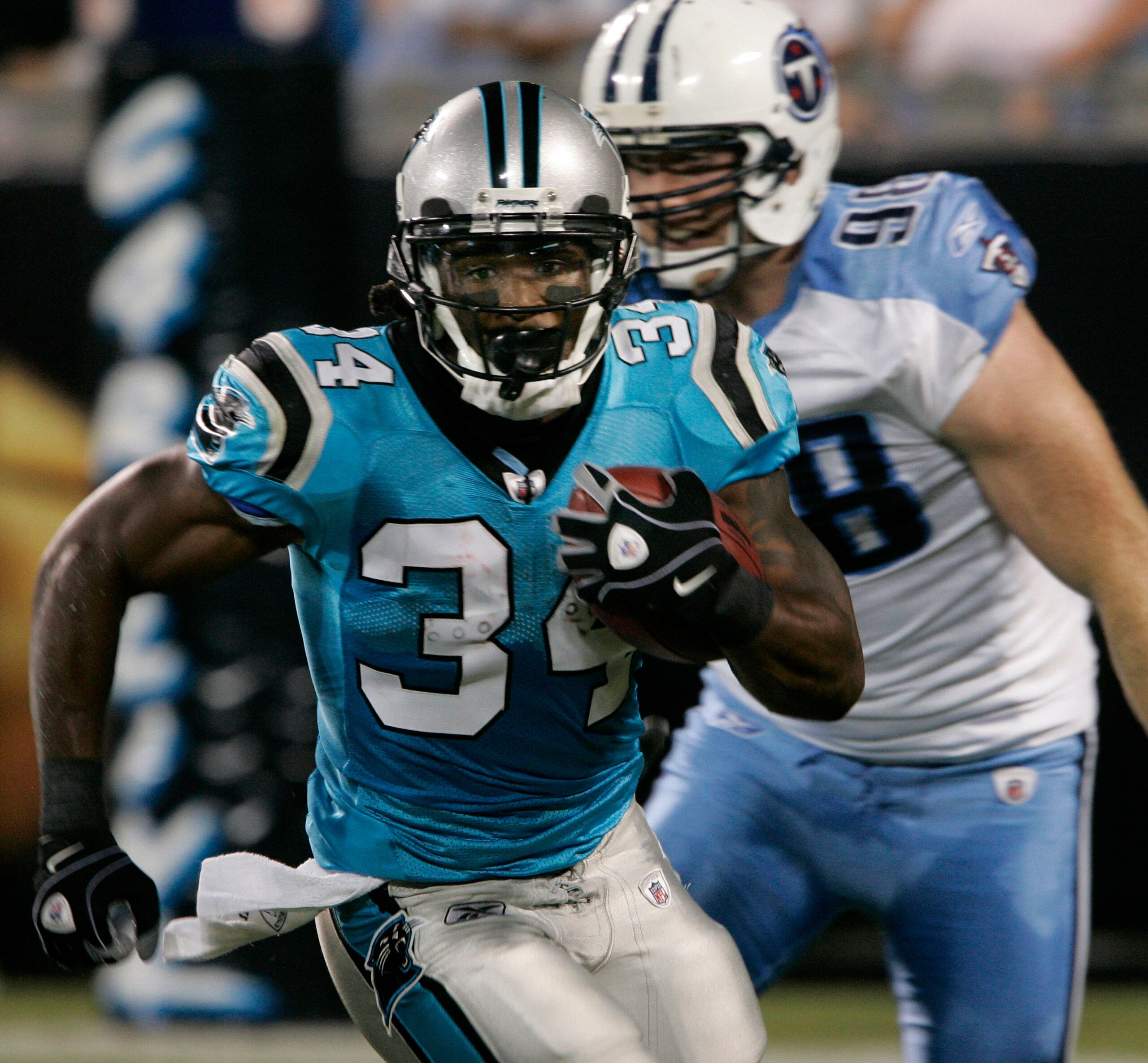 CHARLOTTE, NC _ AUGUST 28: Running back DeAngelo Williams #34 of the Carolina Panthers rushes for yardage during their preseason game against the Tennessee Titans at Bank of America Stadium on August 28, 2010 in Charlotte, North Carolina. (Photo by Mary A