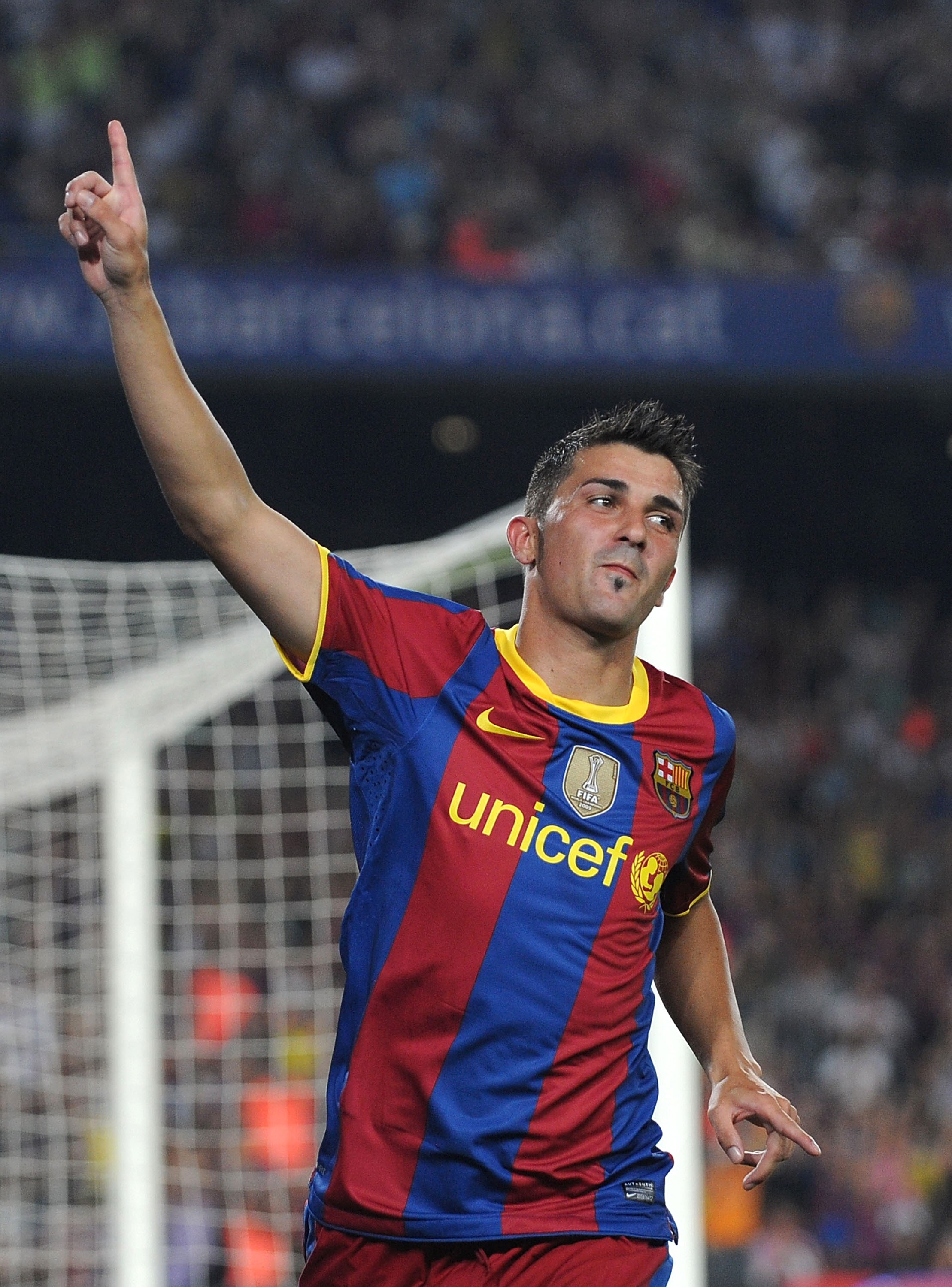BARCELONA, SPAIN - AUGUST 25:  David Villa of Barcelona celebrates after scoring Barcelona's first goal during the Joan Gamper Trophy match between Barcelona and AC Milan at Camp Nou stadium on August 25, 2010 in Barcelona, Spain.  (Photo by Denis Doyle/G