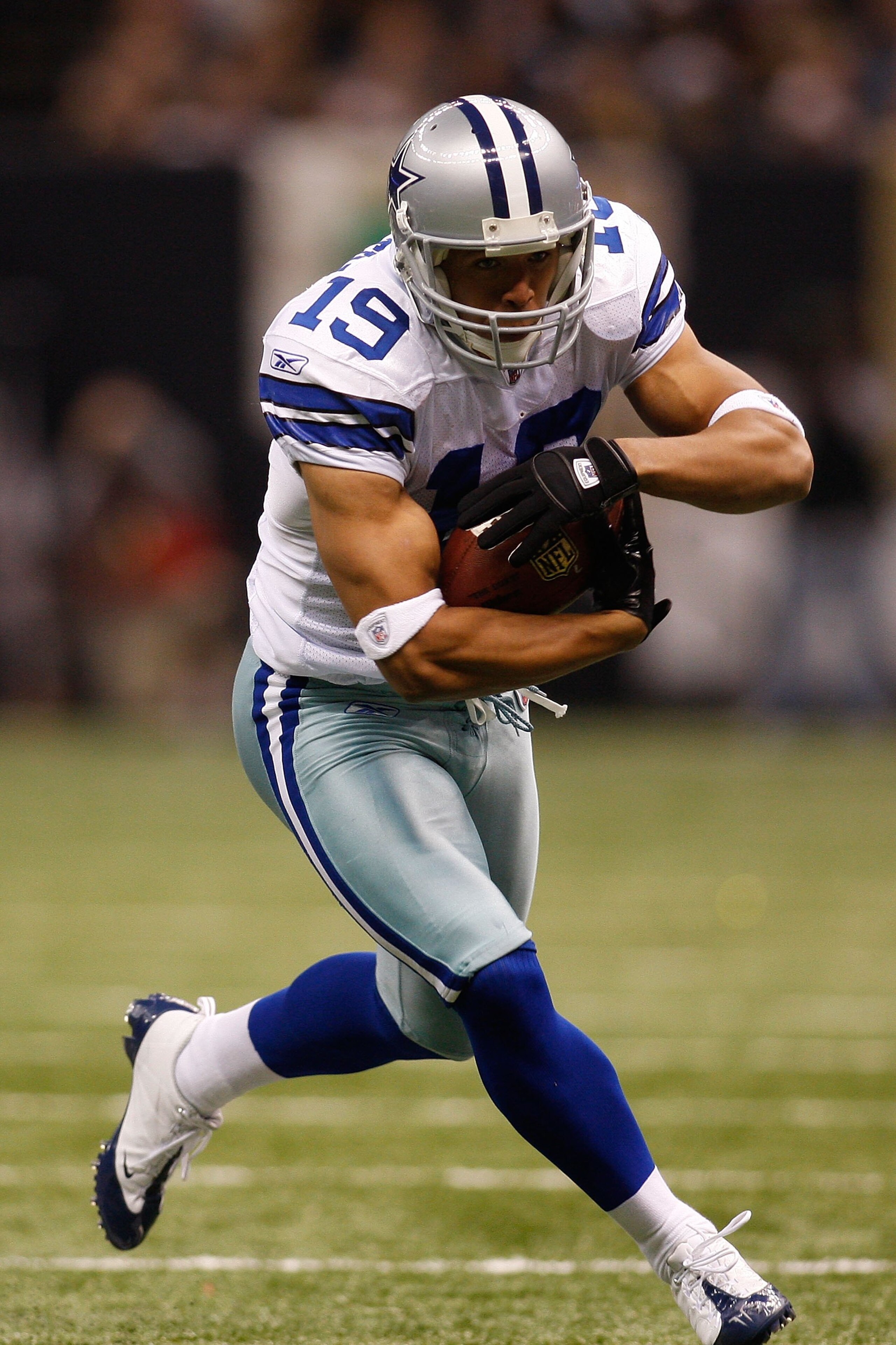 NEW ORLEANS - DECEMBER 19:  Miles Austin #19 of the Dallas Cowboys runs with the ball against the New Orleans Saints at the Louisiana Superdome on December 19, 2009 in New Orleans, Louisiana.  (Photo by Chris Graythen/Getty Images)