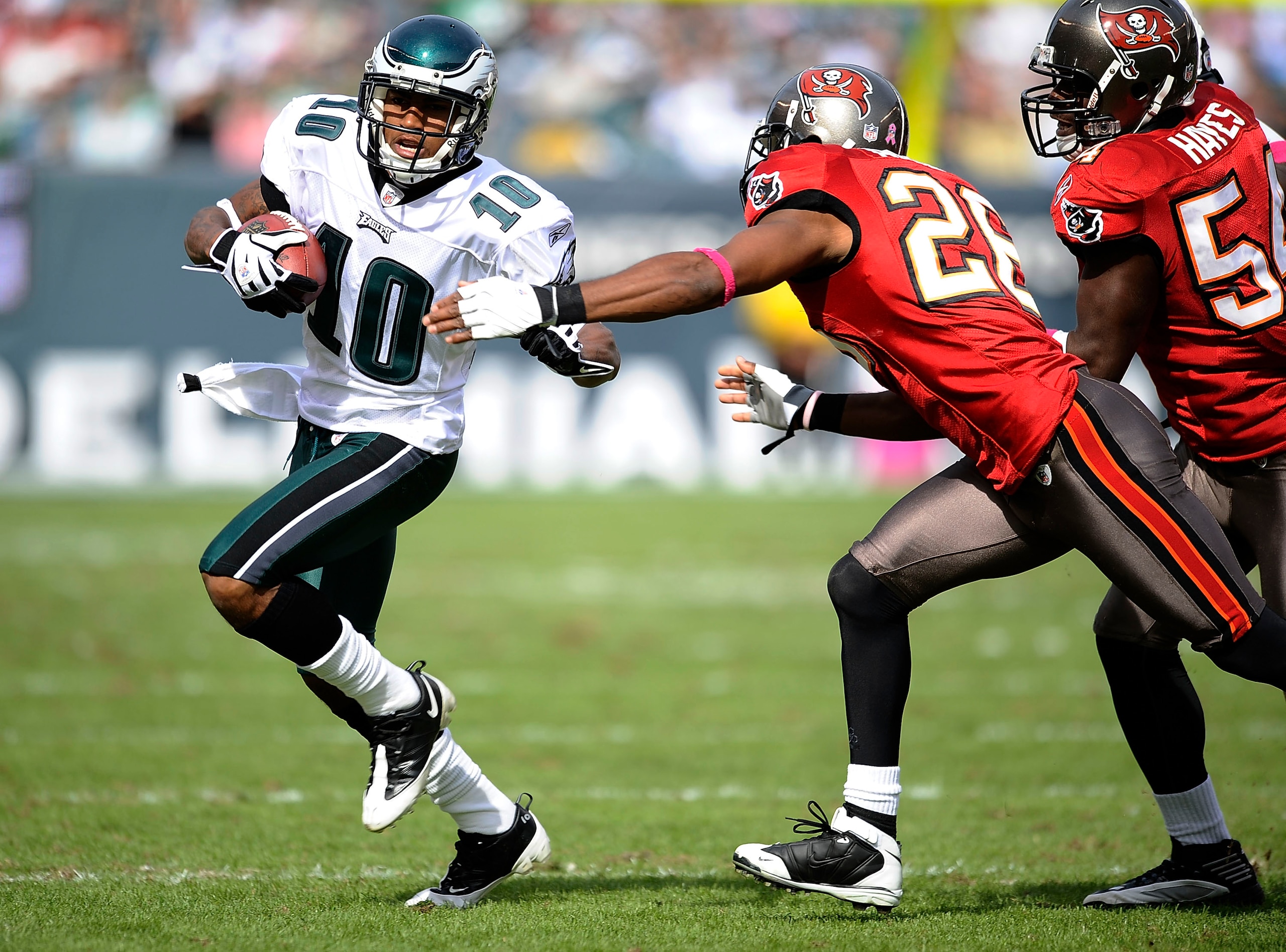 PHILADELPHIA - OCTOBER 11: DeSean Jackson #10 of the Philadelphia Eagles tries to get around Will Allen #26 and Geno Haynes #54 of the Tampa Bay Buccaneers at Lincoln Financial Field on October 11, 2009 in Philadelphia, Pennsylvania.  (Photo by Jeff Zelev
