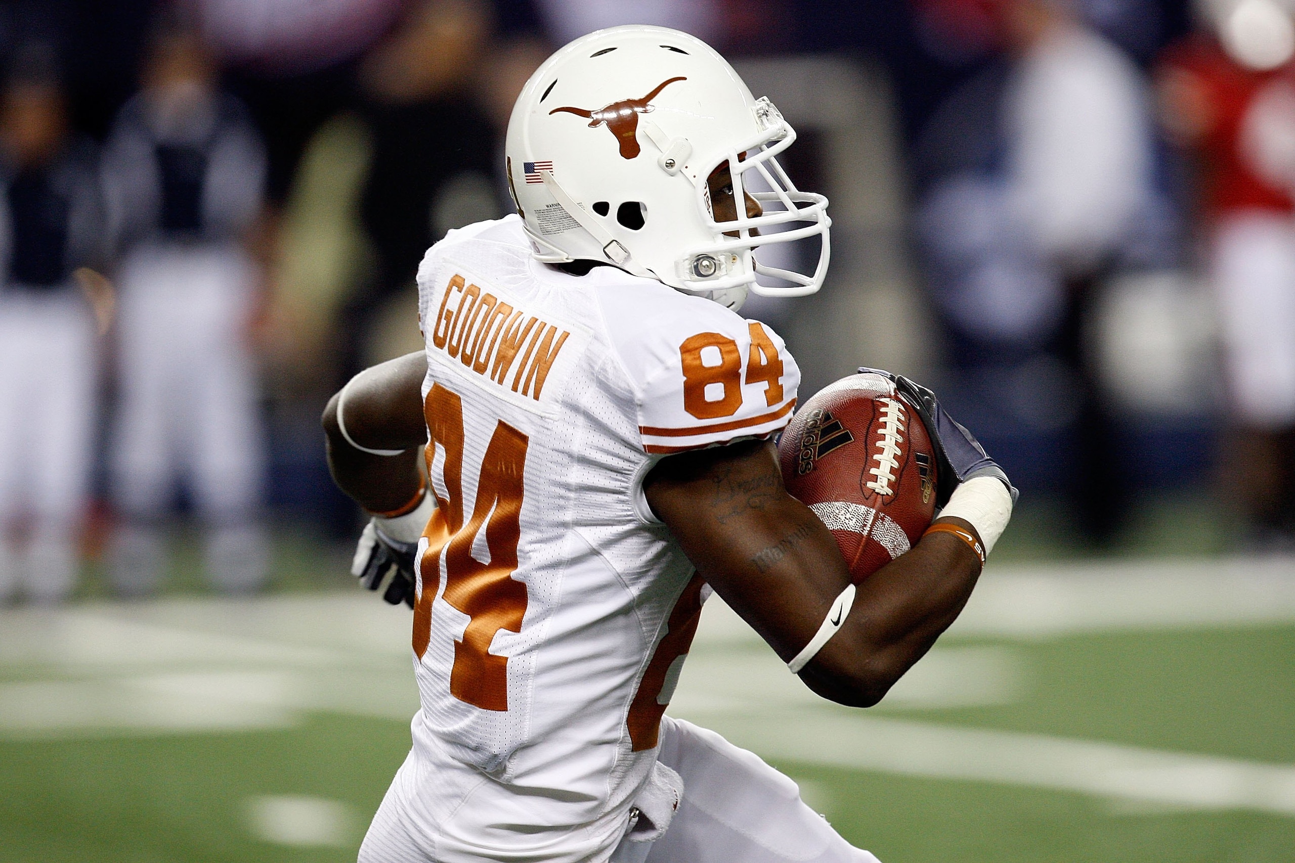 ARLINGTON, TX - DECEMBER 05:  Wide receiver Marquise Goodwin #84 of the Texas Longhorns at Cowboys Stadium on December 5, 2009 in Arlington, Texas.  (Photo by Ronald Martinez/Getty Images)