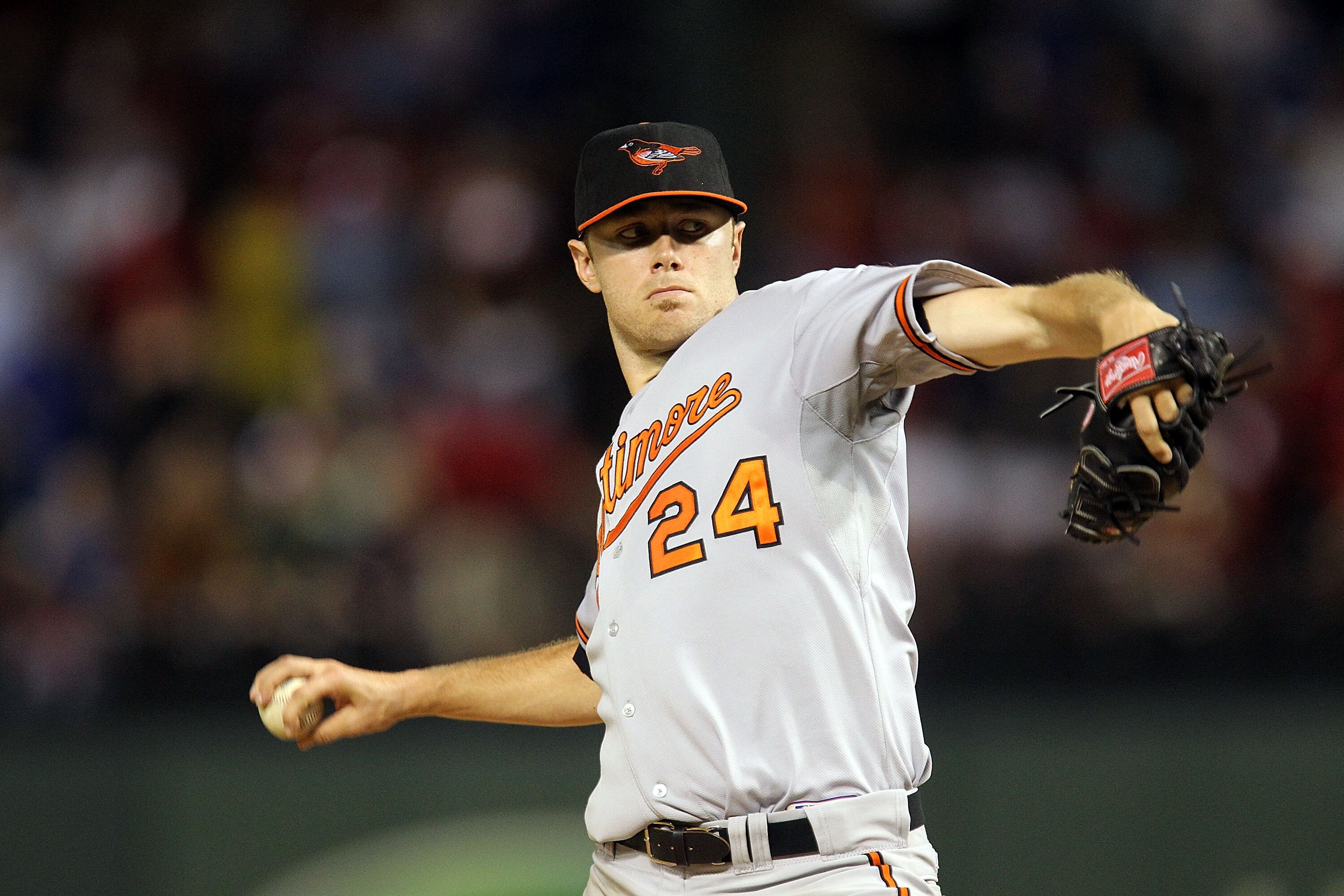 ARLINGTON, TX - JULY 10:  Pitcher Chris Tillman #24 of the Baltimore Orioles throws against the Texas Rangers on July 10, 2010 at Rangers Ballpark in Arlington, Texas.  (Photo by Ronald Martinez/Getty Images)