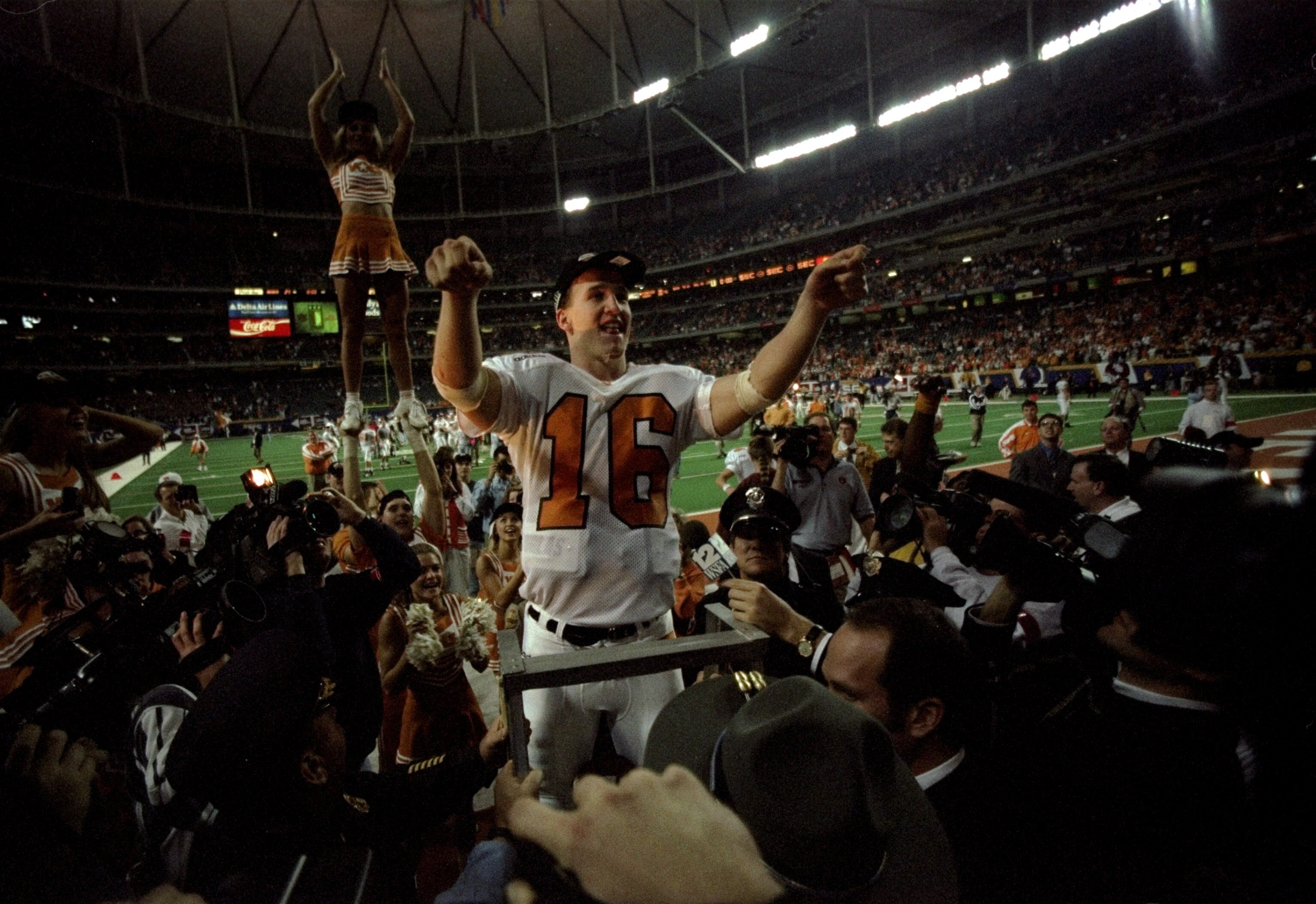 6 Dec 1997: Quarterback Peyton Manning #16 of Tennessee celebrates after the Volunteers 30-29 win over Auburn in the SEC Championship at the Georgia Dome in Atlanta, Georgia.