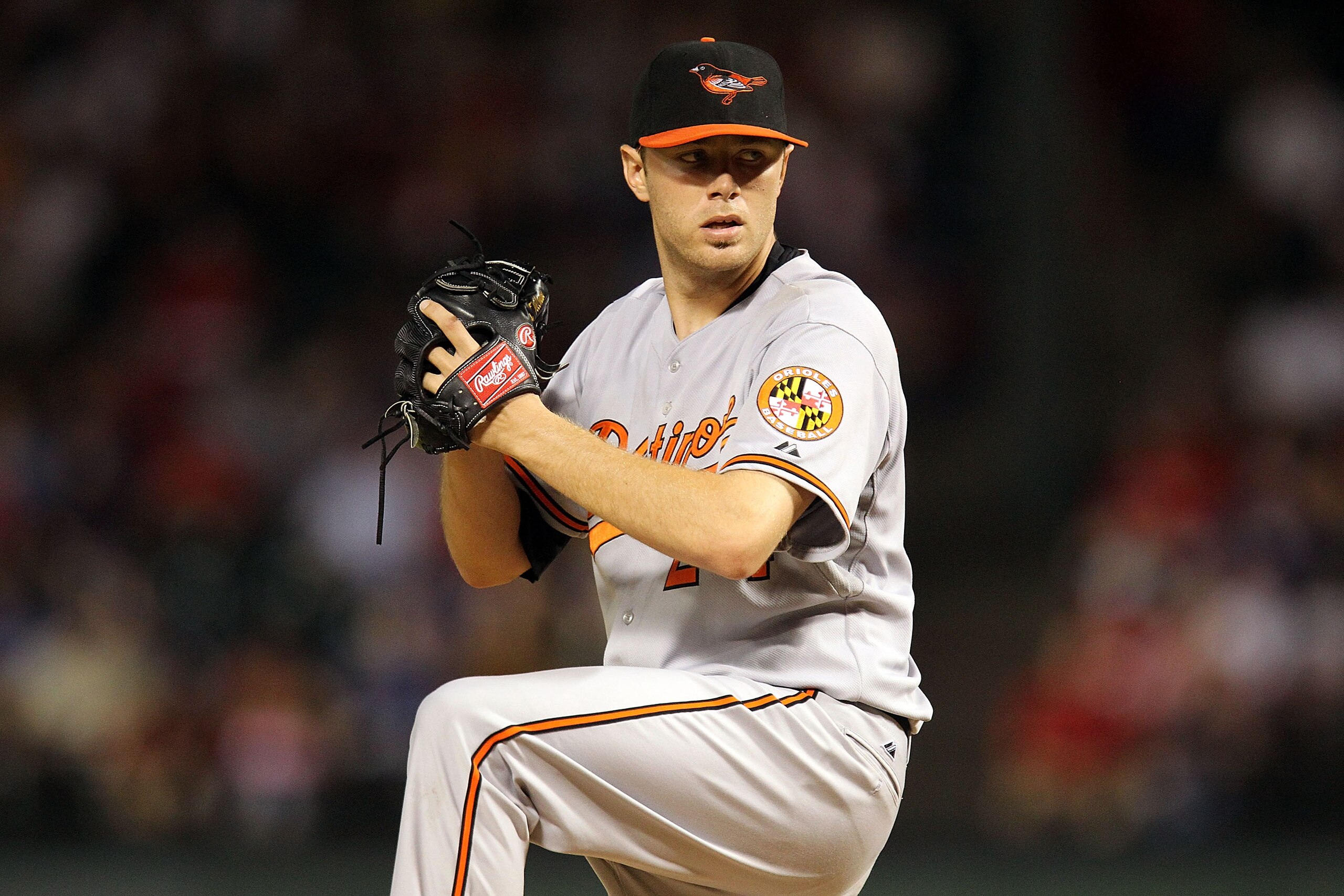 ARLINGTON, TX - JULY 10:  Pitcher Chris Tillman #24 of the Baltimore Orioles throws against the Texas Rangers on July 10, 2010 at Rangers Ballpark in Arlington, Texas.  (Photo by Ronald Martinez/Getty Images)
