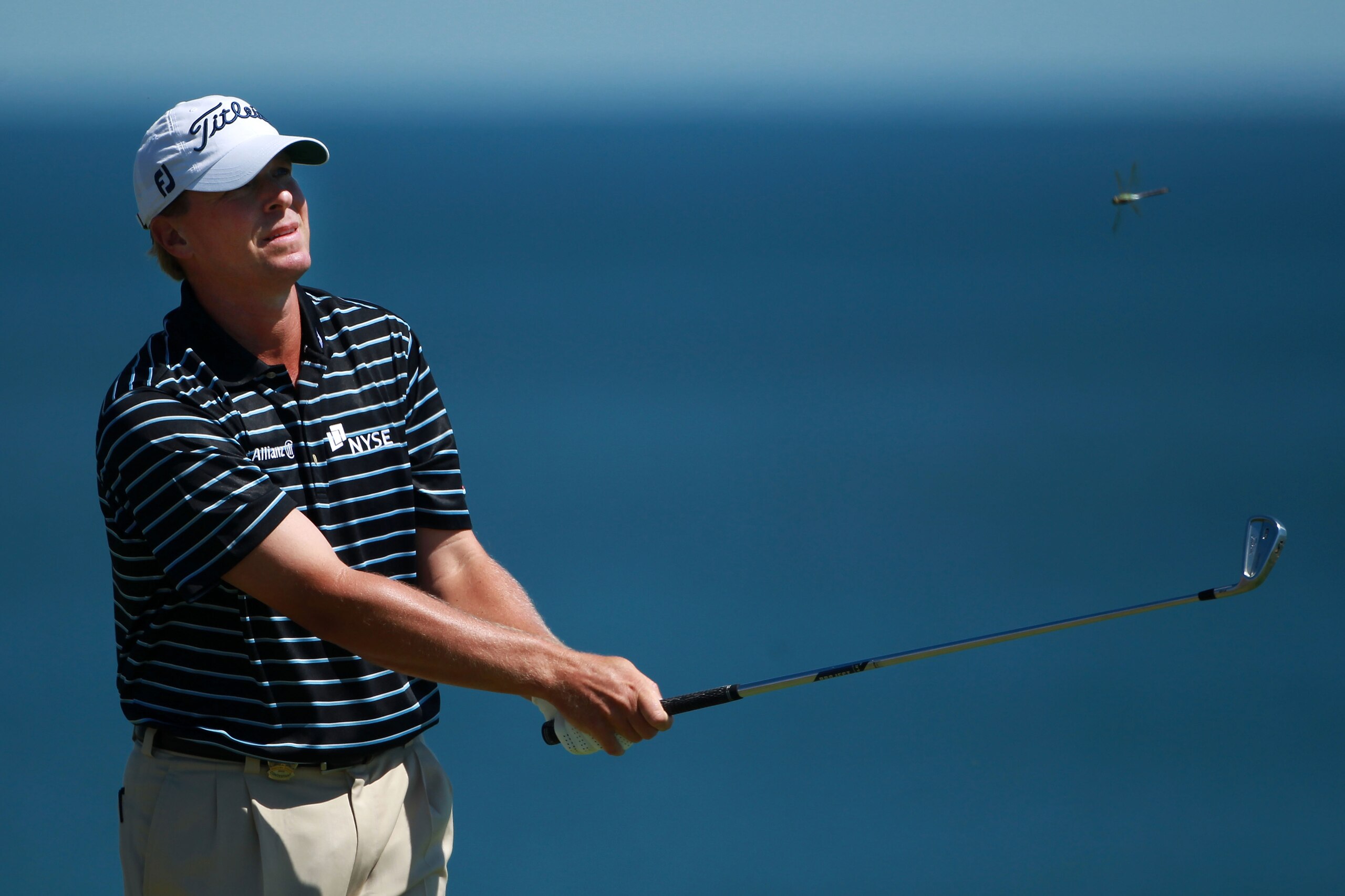 KOHLER, WI - AUGUST 15:  Steve Stricker watches his tee shot on the third hole as a sailboat passes by during the final round of the 92nd PGA Championship on the Straits Course at Whistling Straits on August 15, 2010 in Kohler, Wisconsin.  (Photo by Andre