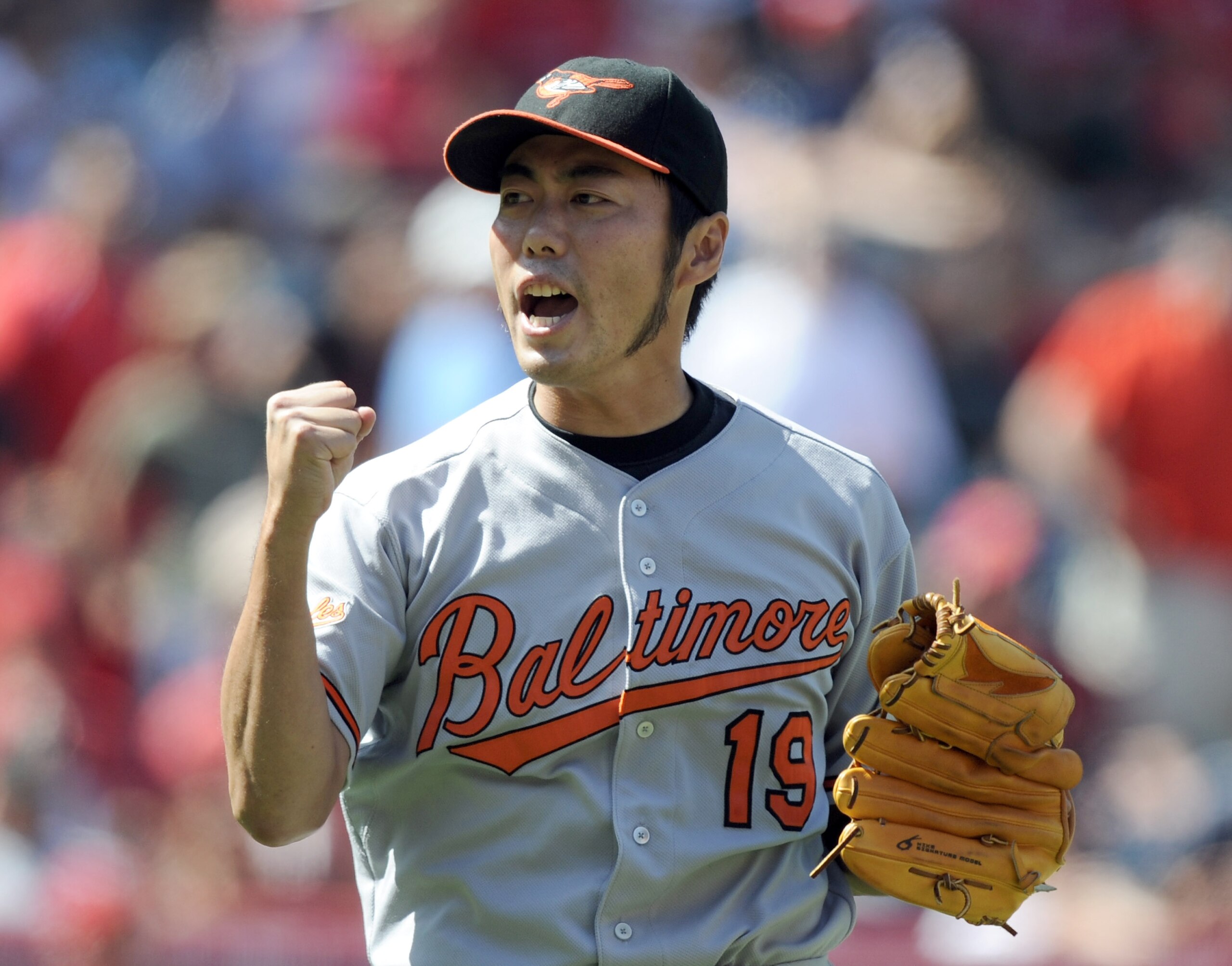 ANAHEIM, CA - AUGUST 29:  Koji Uehara #19 of the Baltimore Orioles celebrates a save and a 1-0 win over the Los Angeles Angels of Anaheim during the ninth inning at Angel Stadium on August 29, 2010 in Anaheim, California.  (Photo by Harry How/Getty Images