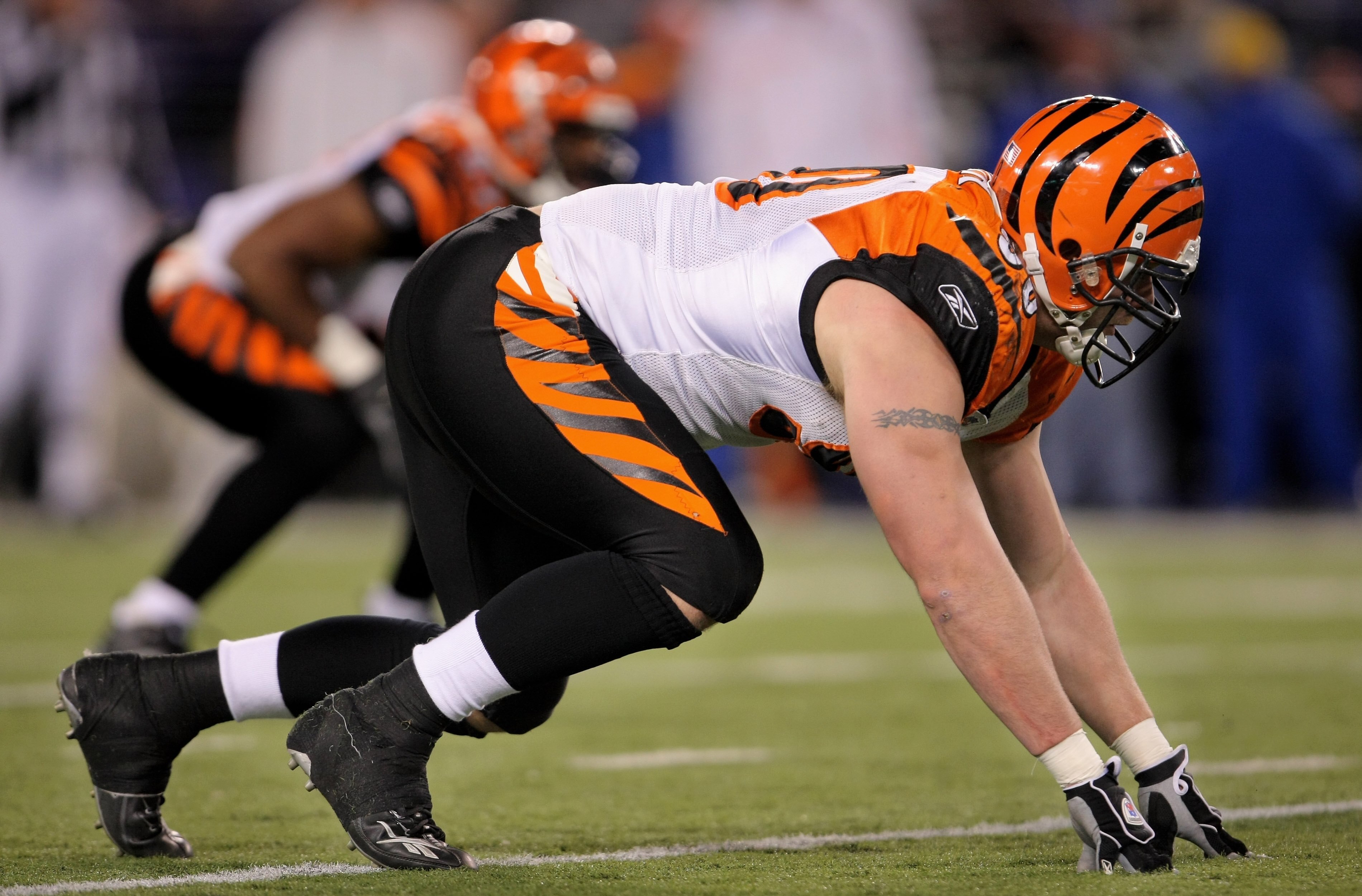 BALTIMORE - NOVEMBER 11:  Defensive end Justin Smith #90 of the Cincinnati Bengals lines up against the Baltimore Ravens at M&T Bank Staduim on November 11, 2007 in Baltimore, Maryland. Cincinnati defeated Baltimore 21-7.  (Photo by Doug Pensinger/Getty I