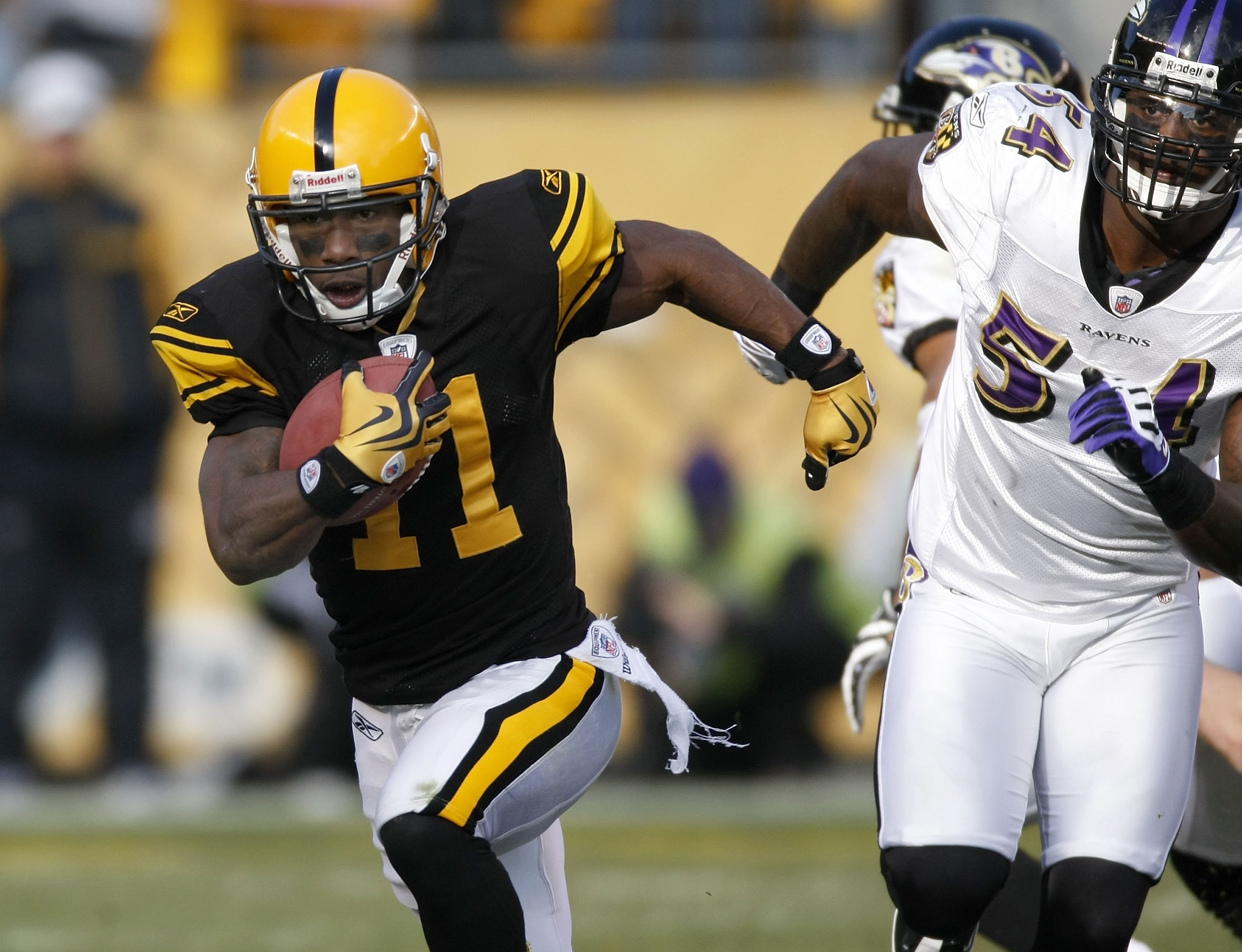 PITTSBURGH - DECEMBER 27: Stefan Logan #11 of the Pittsburgh Steelers returns a second quarter punt in front of Prescott Burgess #54 of the Baltimore Ravens on December 27, 2009 at Heinz Field in Pittsburgh, Pennsylvania. Pittsburgh won the game 23-20.  (