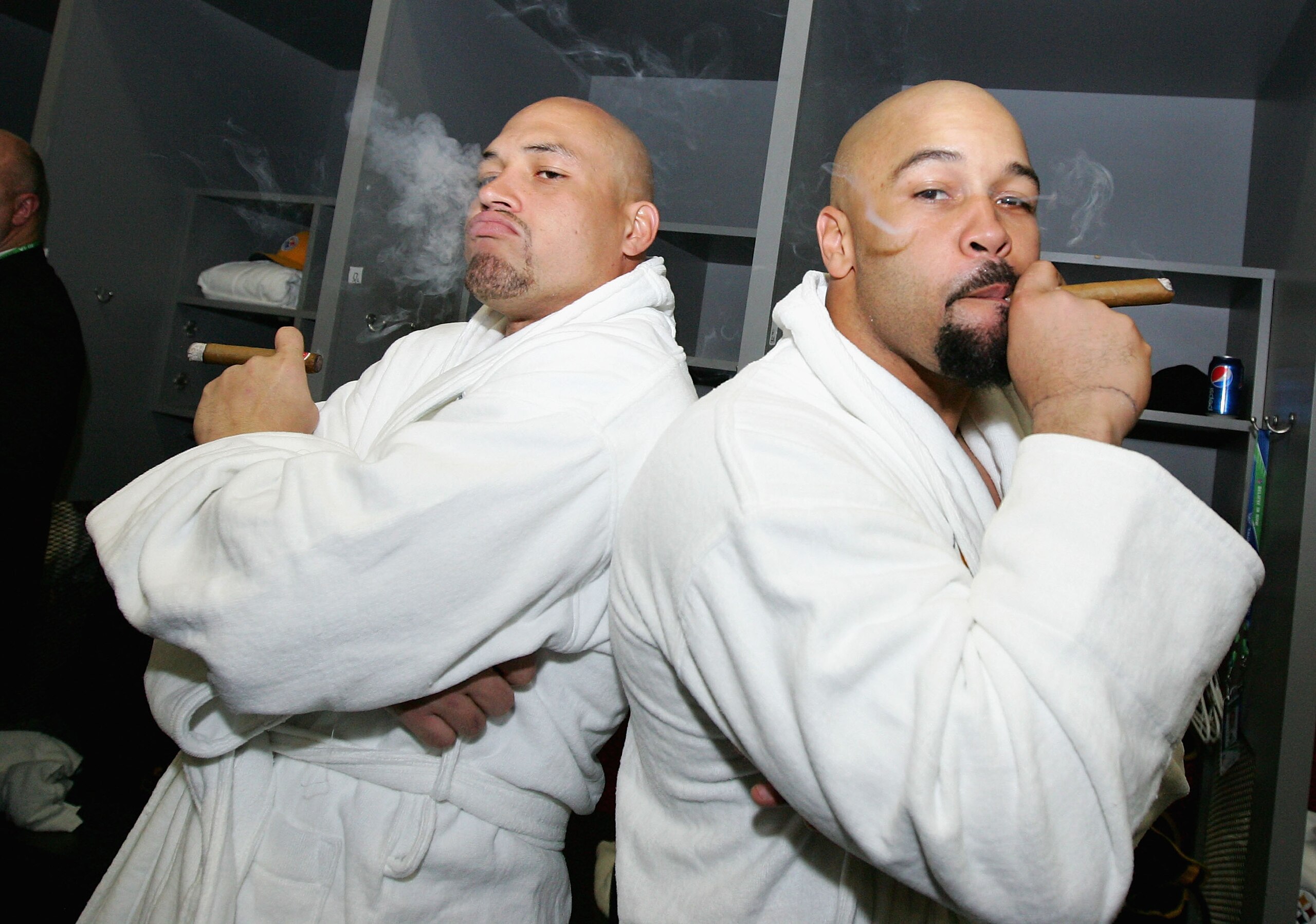 TAMPA, FL - FEBRUARY 01:  James Farrior #51 and Larry Foote #50 of the Pittsburgh Steelers celebrate with cigars in the locker room after defeating the Arizona Cardinals during Super Bowl XLIII on February 1, 2009 at Raymond James Stadium in Tampa, Florid