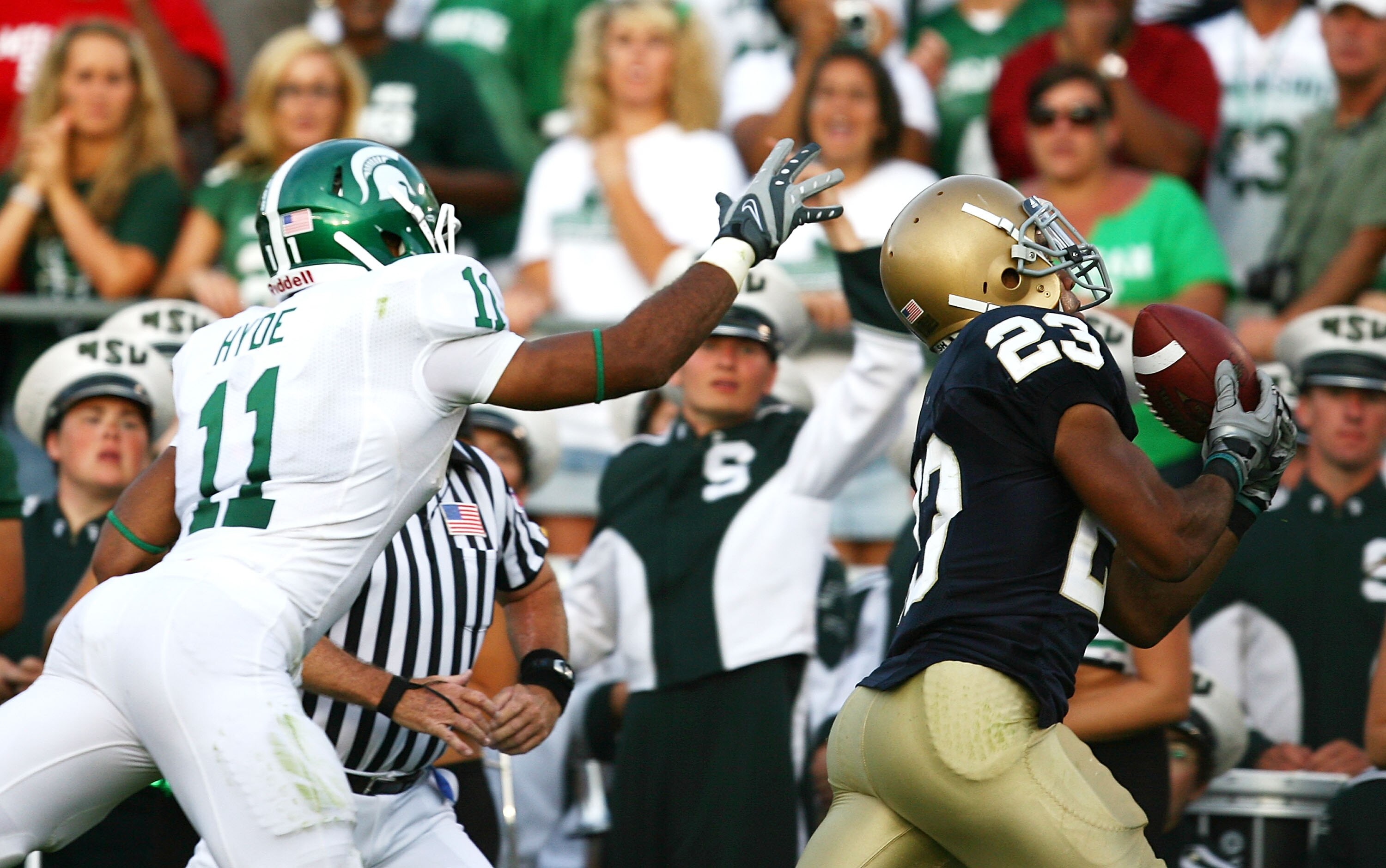 SOUTH BEND, IN - SETPEMBER 19: Golden Tate #23 of the Notre Dame Fighting Irish catches the game- winning touchdown pass over Marcus Hyde #11 of the Michigan State Spartans on September 19, 2009 at Notre Dame Stadium in South Bend, Indiana. Notre Dame def