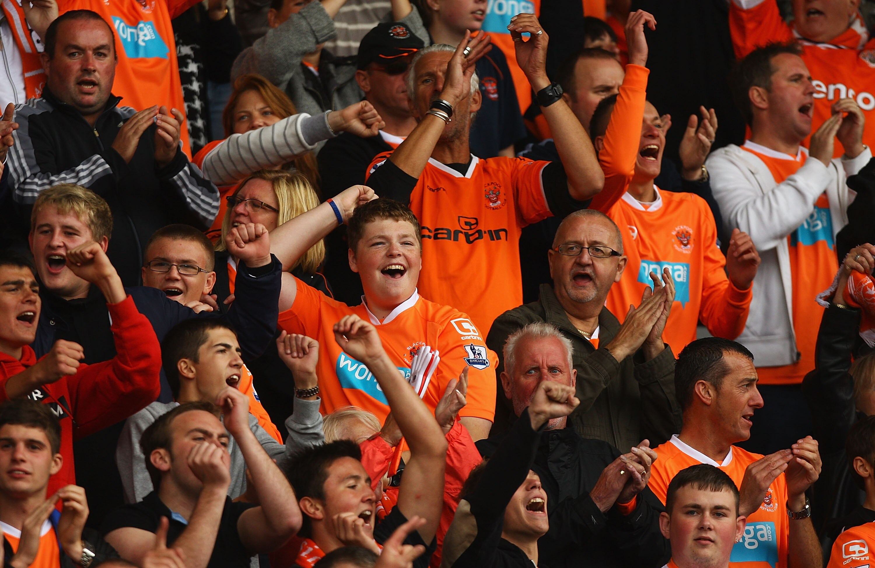 BLACKPOOL, ENGLAND - AUGUST 28:  Blackpool fans celebrate Luke Varney's goal during the Barclays Premier League match between Blackpool and Fulham at Bloomfield Road on August 28, 2010 in Blackpool, England.  (Photo by Matthew Lewis/Getty Images)