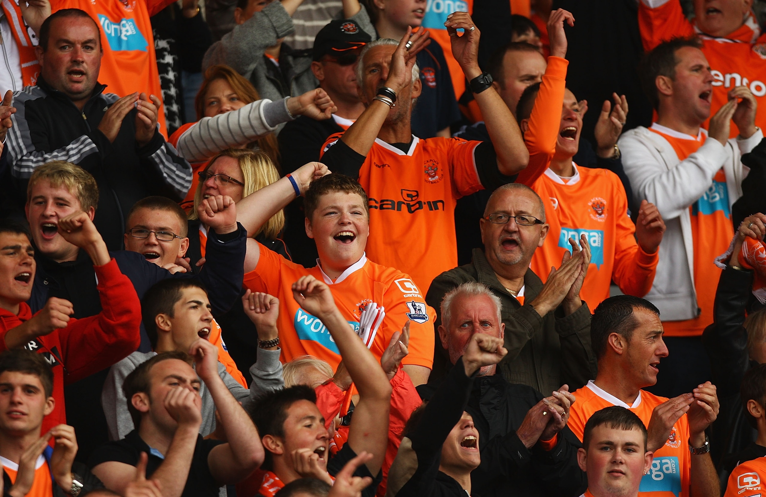 BLACKPOOL, ENGLAND - AUGUST 28:  Blackpool fans celebrate Luke Varney's goal during the Barclays Premier League match between Blackpool and Fulham at Bloomfield Road on August 28, 2010 in Blackpool, England.  (Photo by Matthew Lewis/Getty Images)