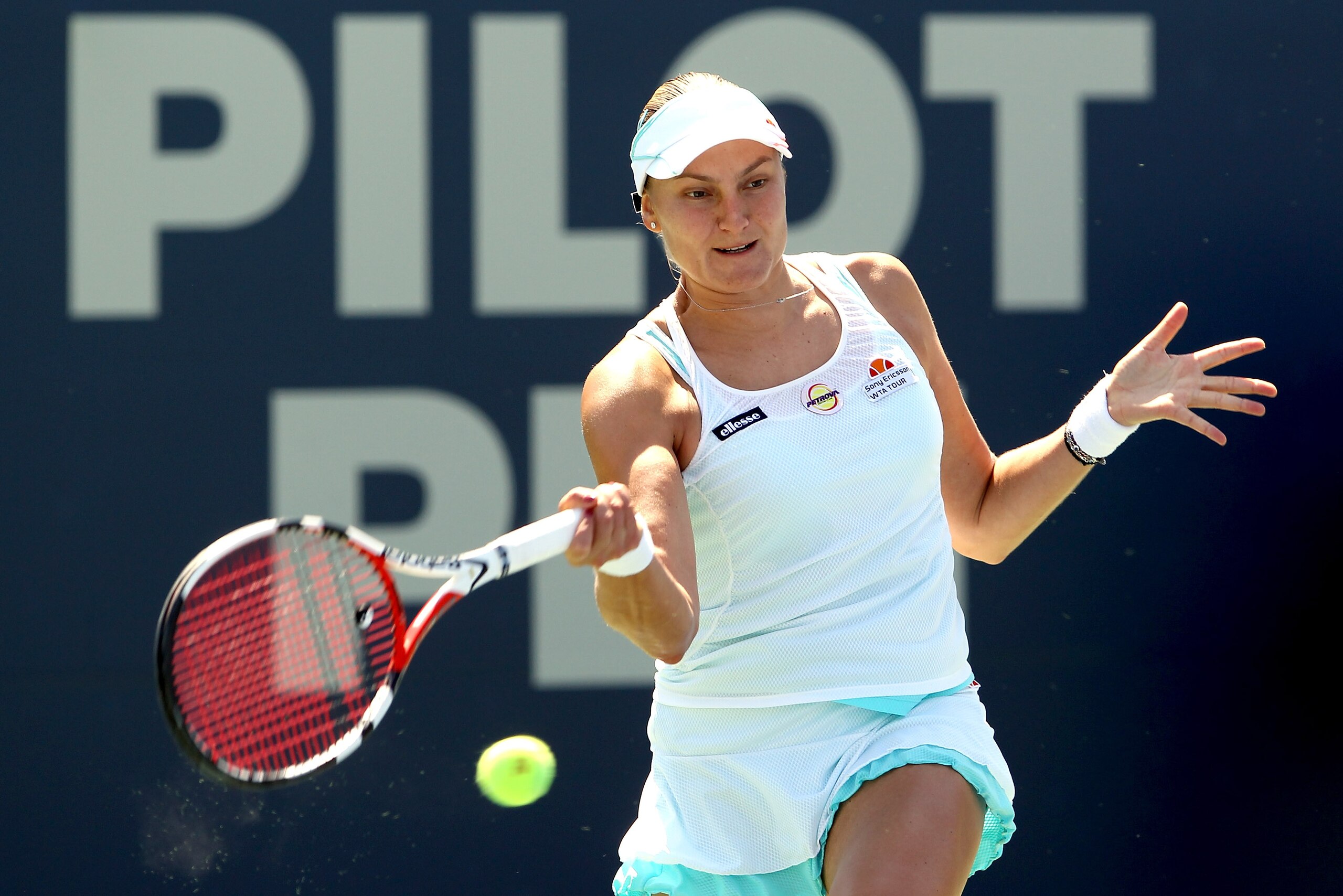 NEW HAVEN, CT - AUGUST 28:  Nadia Petrova of Russia returns a shot to Caroline Wozniacki of Denmark during the final of the Pilot Pen tennis tournament at the Connecticut Tennis Center on August 28, 2010 in New Haven, Connecticut. Wozniacki beat Petrova 6