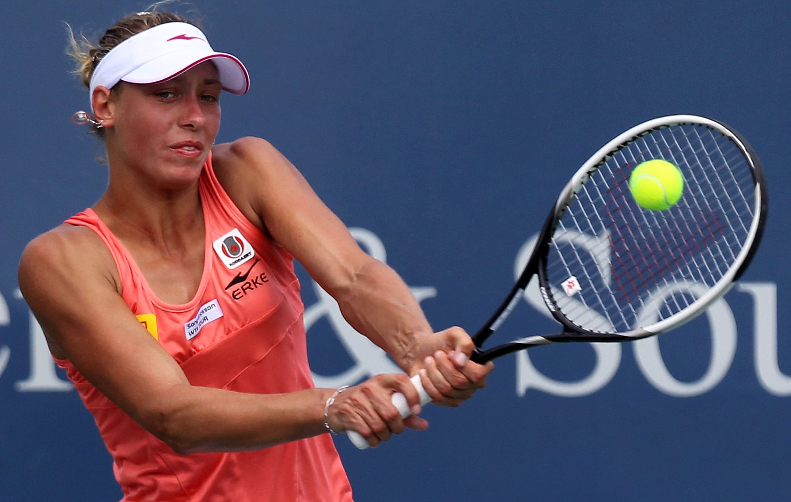CINCINNATI - AUGUST 13:  Yanina Wickmayer of Belgium hits a backhand return during her quarter final match with Anastasia Pavlyuchenkova of Russia on day five of the Western & Southern Financial Group Women's Open on August 13, 2010 at the Lindner Family