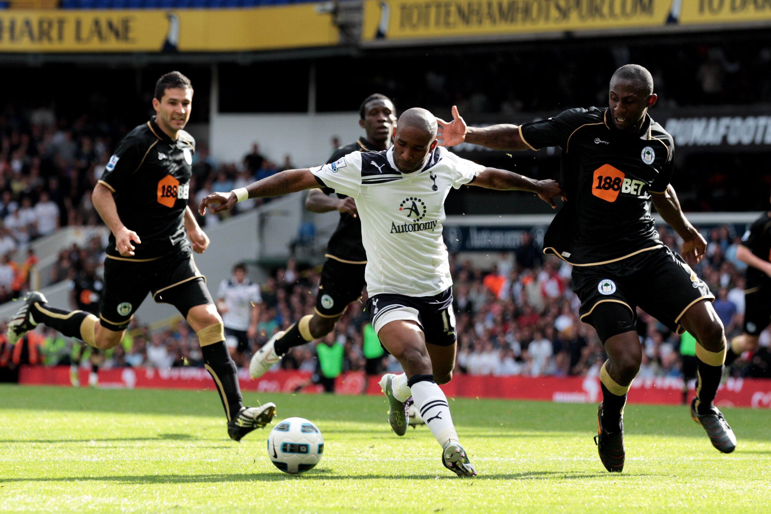 LONDON, ENGLAND - AUGUST 28:  Jermain Defoe of Tottenham battles for the ball with Steve Gohouri of Wigan during the Barclays Premier League match between Tottenham Hotspur and Wigan Athletic at White Hart Lane on August 28, 2010 in London, England.  (Pho
