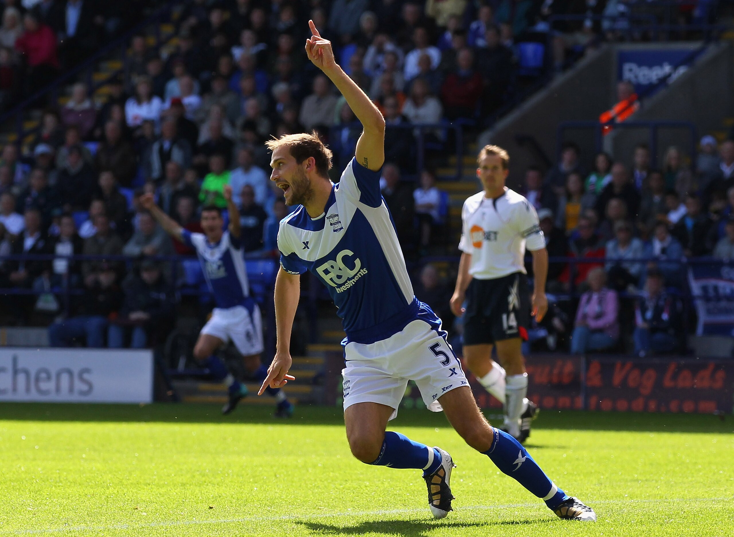 BOLTON, ENGLAND - AUGUST 29:  Roger Johnson of Birmingham City turns to celebrate after scoring the opening goal during the Barclays Premier League match between Bolton Wanderers and Birmingham City at Reebok Stadium on August 29, 2010 in Bolton, England.