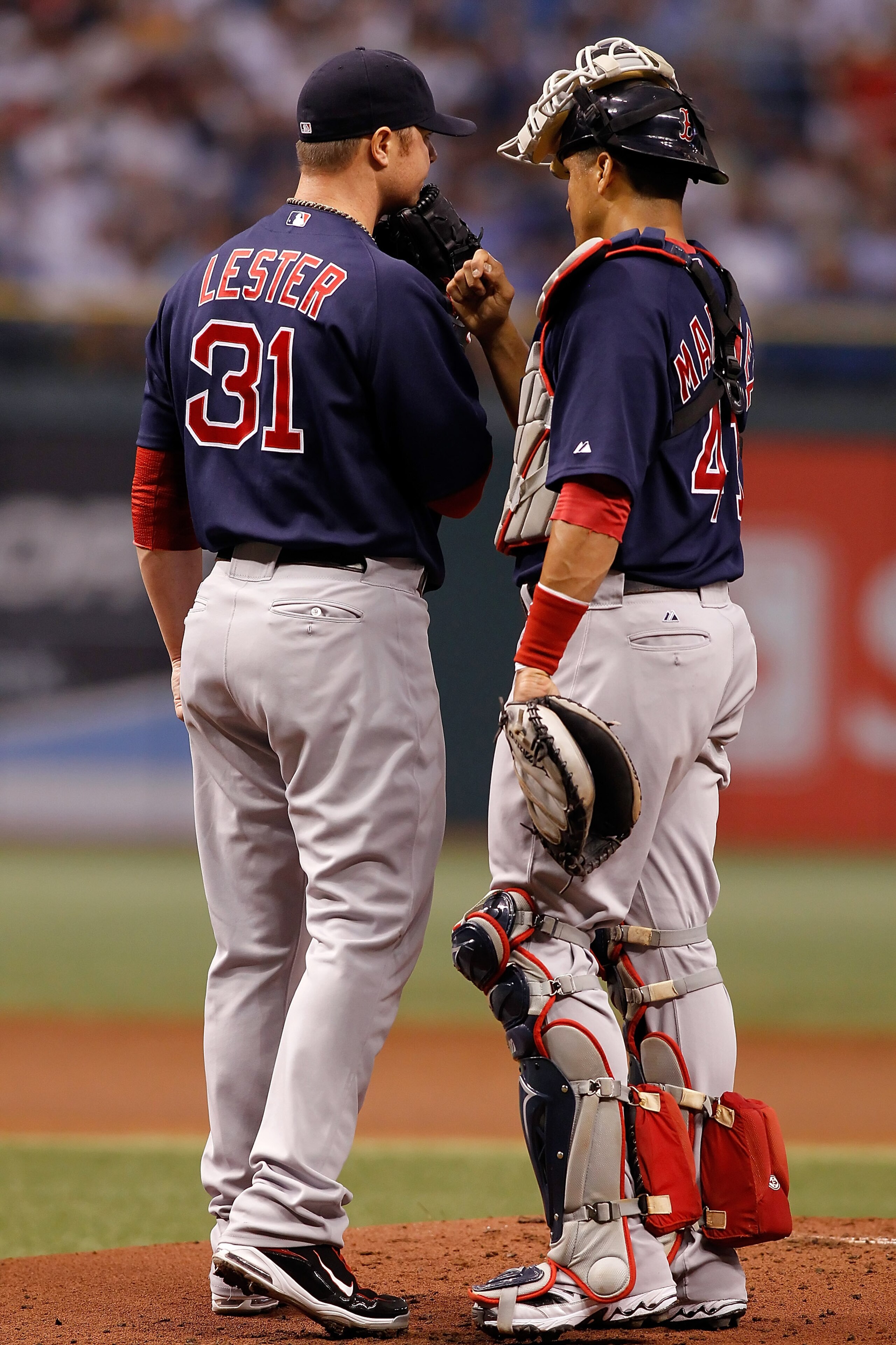 ST. PETERSBURG, FL - AUGUST 27:  Pitcher Jon Lester #31 and catcher Victor Martinez #41 of the Boston Red Sox have a conversation at the mound against the Tampa Bay Rays during the game at Tropicana Field on August 27, 2010 in St. Petersburg, Florida.  (P