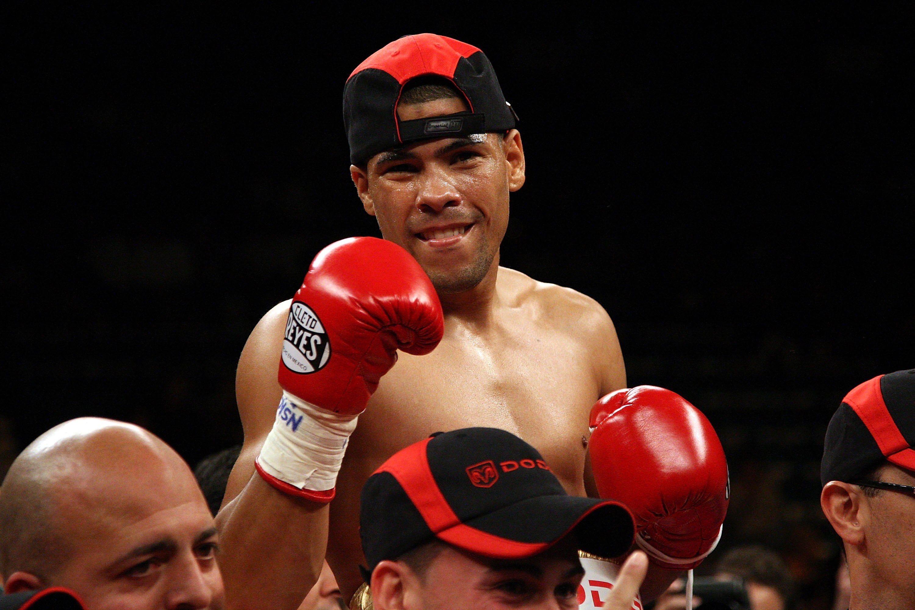 LAS VEGAS - DECEMBER 06:  (L-R) Juan Manuel Lopez of Puerto Rico celebrates his first round knockout of Sergio Medina of Argentina during their WBO junior featherweight title fight at the MGM Grand Garden Arena December 6, 2008 in Las Vegas, Nevada.  (Pho