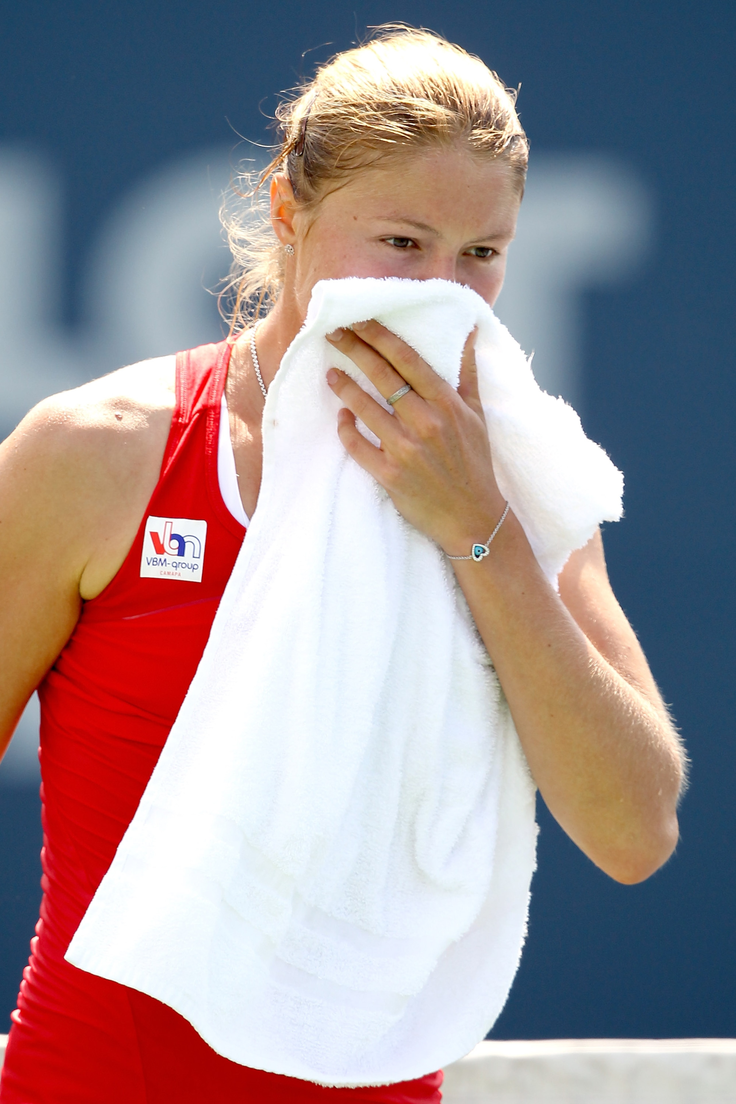 NEW HAVEN, CT - AUGUST 26: Dinara Safina of Russia wipes her face between points against  Maria Kirilenko of Russia during the Pilot Pen tennis tournament at the Connecticut Tennis Center on August 26, 2010 in New Haven, Connecticut.  (Photo by Matthew St