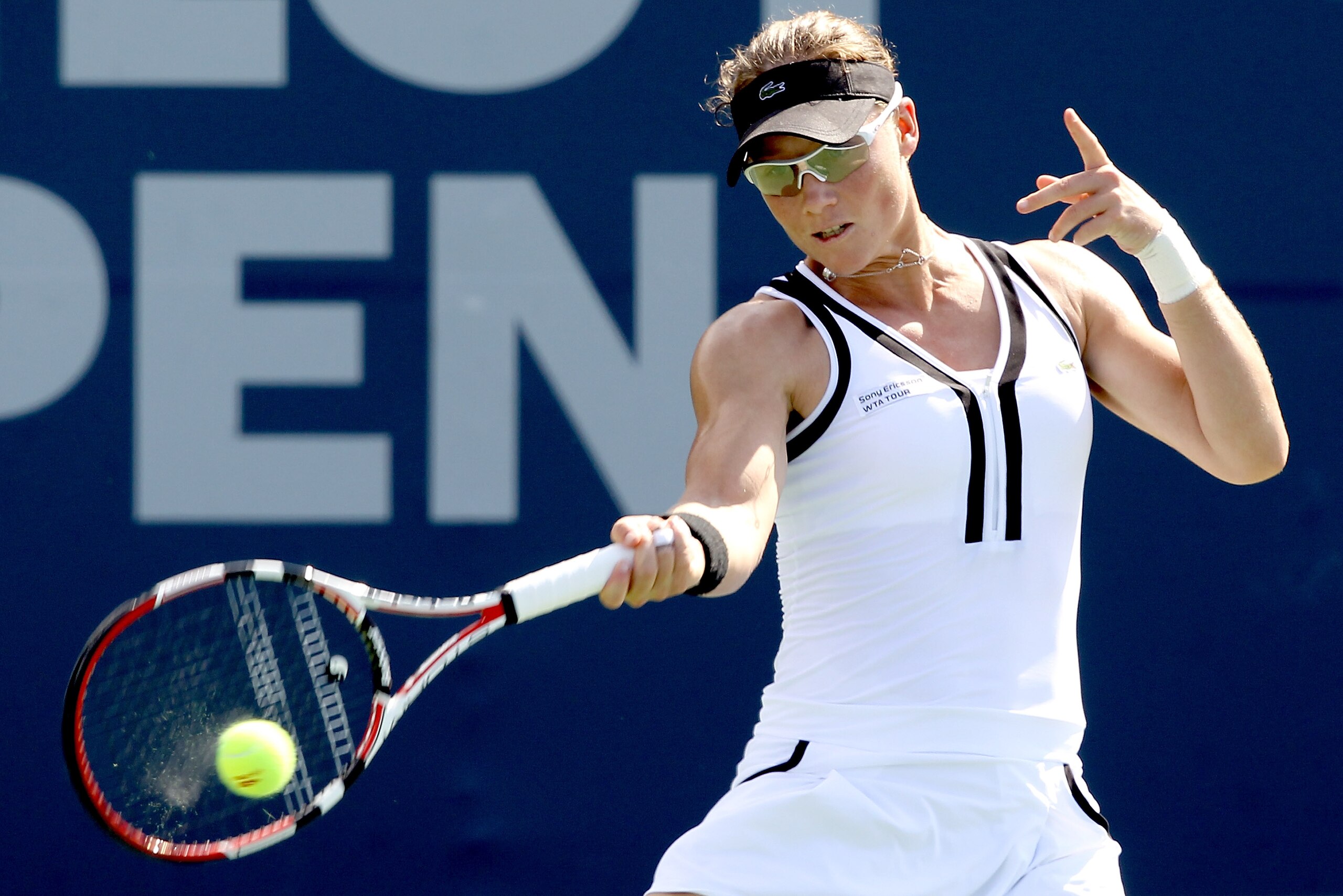 NEW HAVEN, CT - AUGUST 26:  Samantha Stosur of Australia returns a shot to Nadia Petrova of Russia during the Pilot Pen tennis tournament at the Connecticut Tennis Center on August 26, 2010 in New Haven, Connecticut.  (Photo by Matthew Stockman/Getty Imag