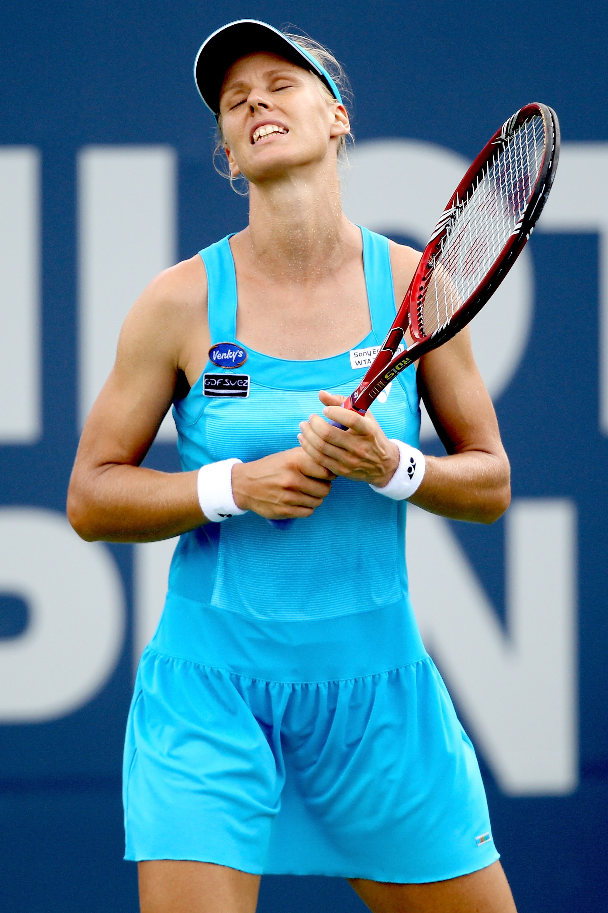 NEW HAVEN, CT - AUGUST 26:  Elena Dementieva of Russia reacts to a lost point against Marion Bartoli of France during the Pilot Pen tennis tournament at the Connecticut Tennis Center on August 26, 2010 in New Haven, Connecticut.  (Photo by Matthew Stockma