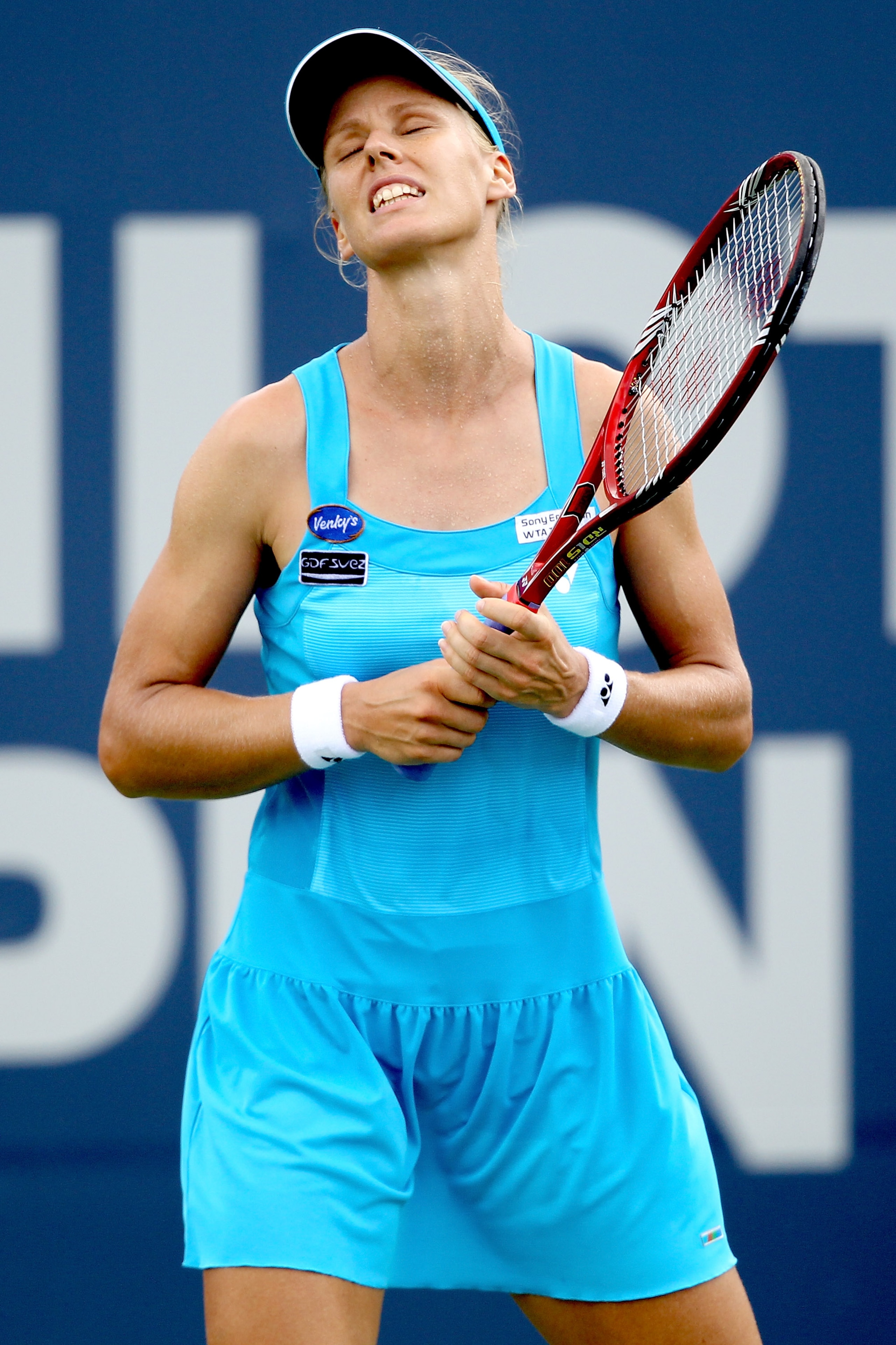 NEW HAVEN, CT - AUGUST 26:  Elena Dementieva of Russia reacts to a lost point against Marion Bartoli of France during the Pilot Pen tennis tournament at the Connecticut Tennis Center on August 26, 2010 in New Haven, Connecticut.  (Photo by Matthew Stockma