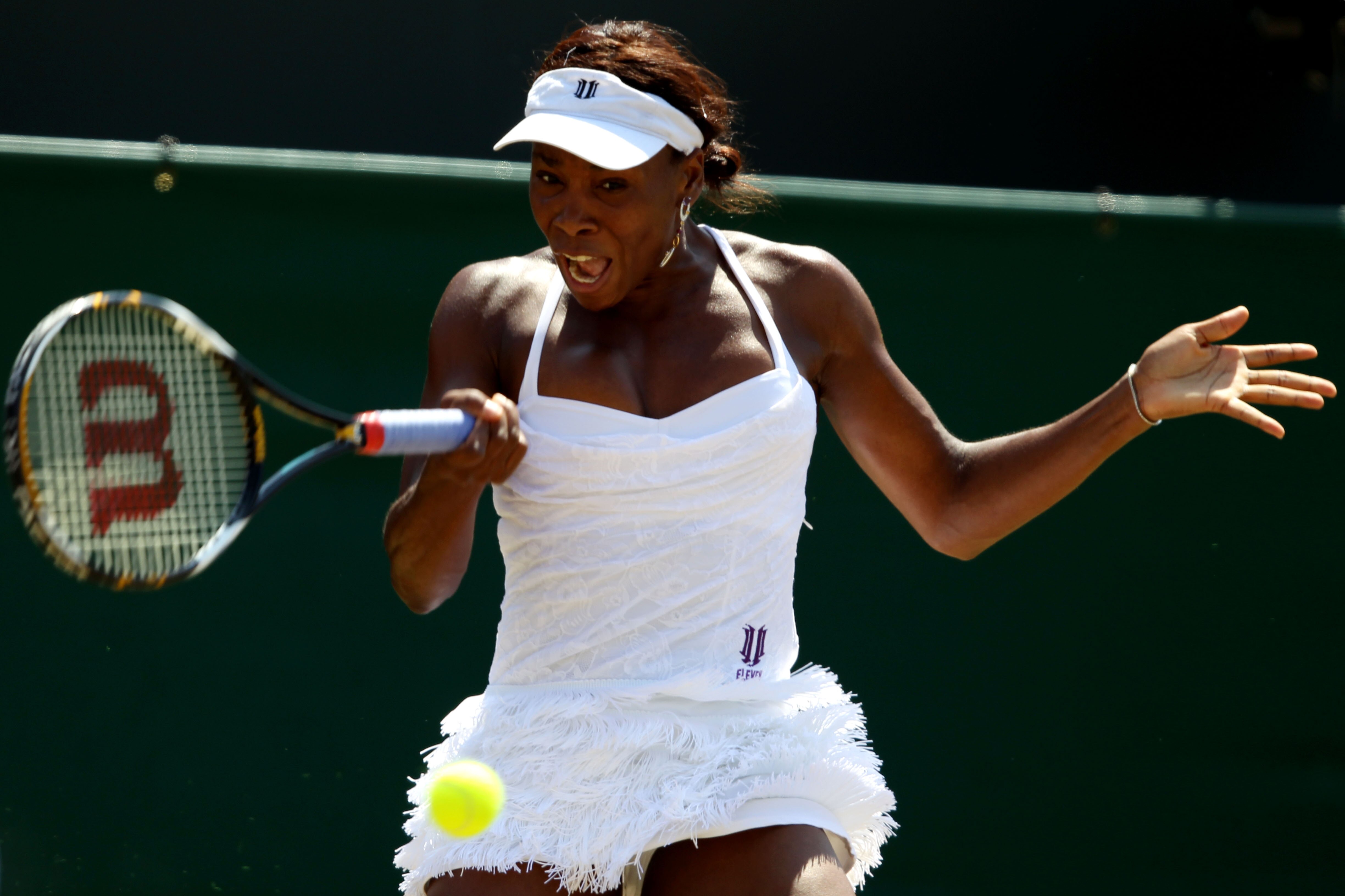 LONDON, ENGLAND - JUNE 28:  Venus Williams of USA plays a shot during her match against Jarmila Groth of Australia on Day Seven of the Wimbledon Lawn Tennis Championships at the All England Lawn Tennis and Croquet Club on June 28, 2010 in London, England.