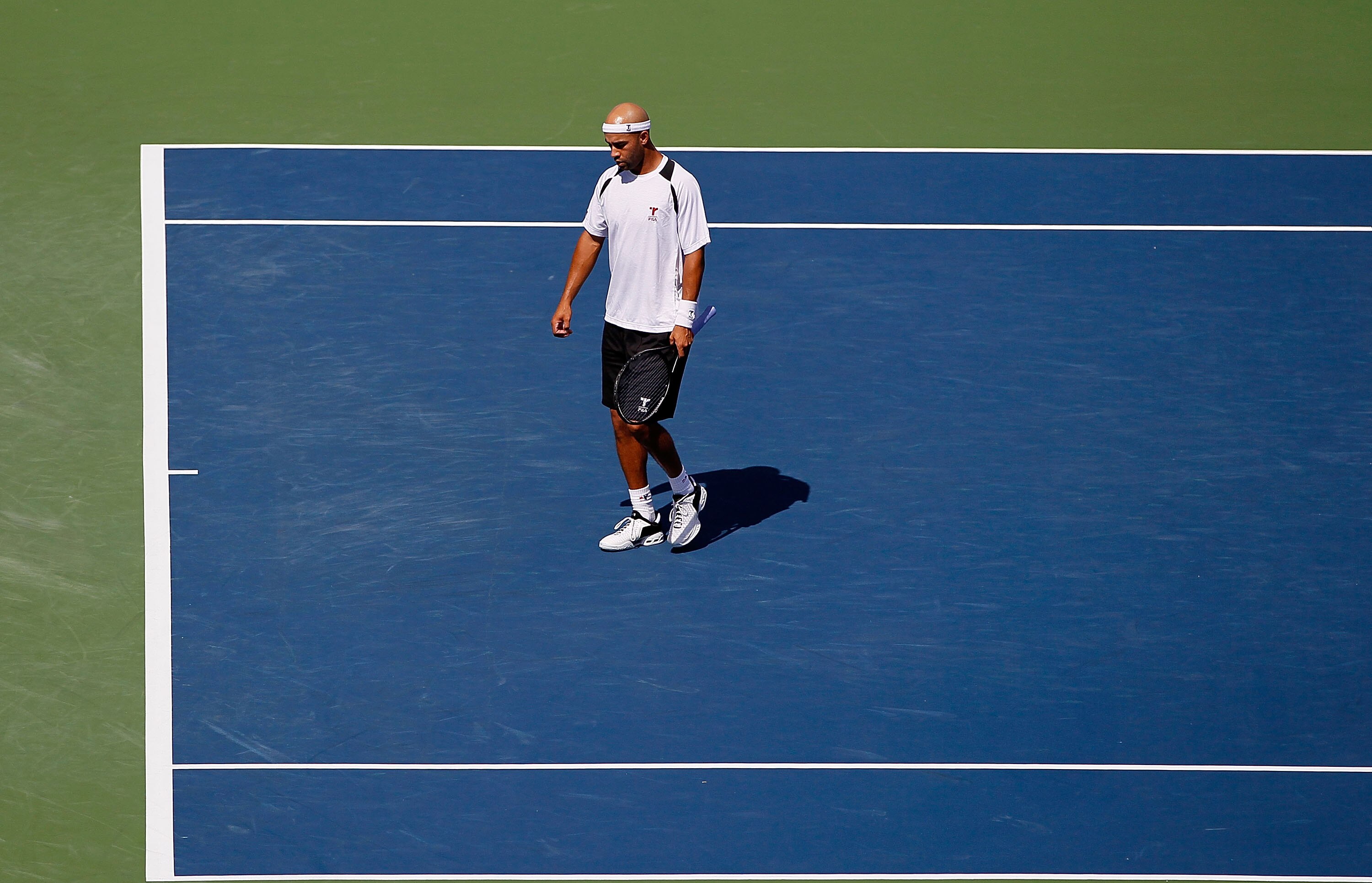 CINCINNATI - AUGUST 17: James Blake walks to the service line in between games against Denis Istomin of Uzebekistan during Day 2 of the Western & Southern Financial Group Masters at the Lindner Family Tennis Center on August 17, 2010 in Cincinnati, Ohio. CINCINNATI - AUGUST 17: James Blake walks to the service line in between games against Denis Istomin of Uzebekistan during Day 2 of the Western & Southern Financial Group Masters at the Lindner Family Tennis Center on August 17, 2010 in Cincinnati, Ohio.