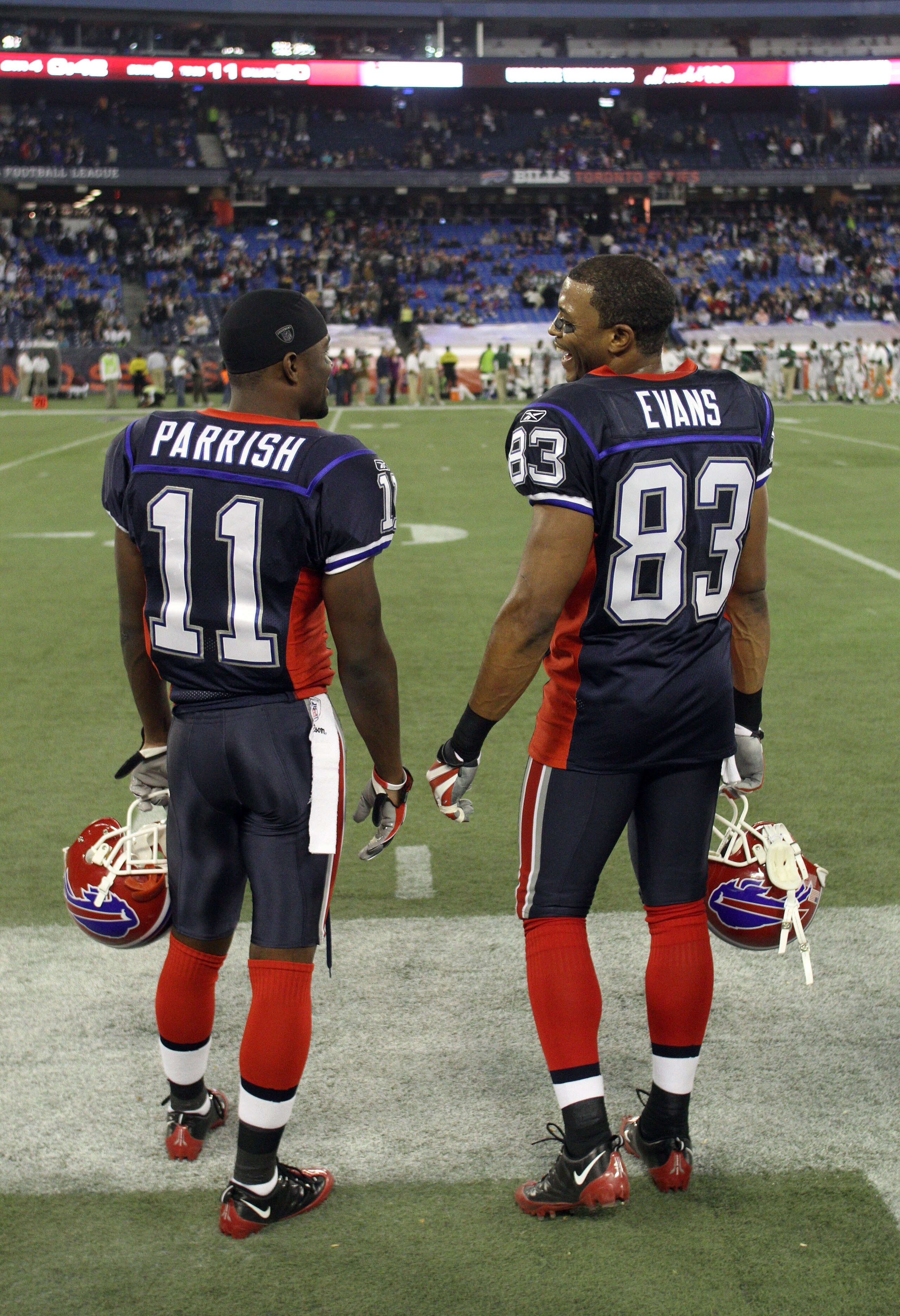 TORONTO - DECEMBER 3:  Roscoe Parrish #11 and Lee Evans #83 of the Buffalo Bills share a conversation on the side line during their NFL game against the New York Jets on December 3, 2009  at Rogers Centre in Toronto, Ontario, Canada. The Jets defeated the