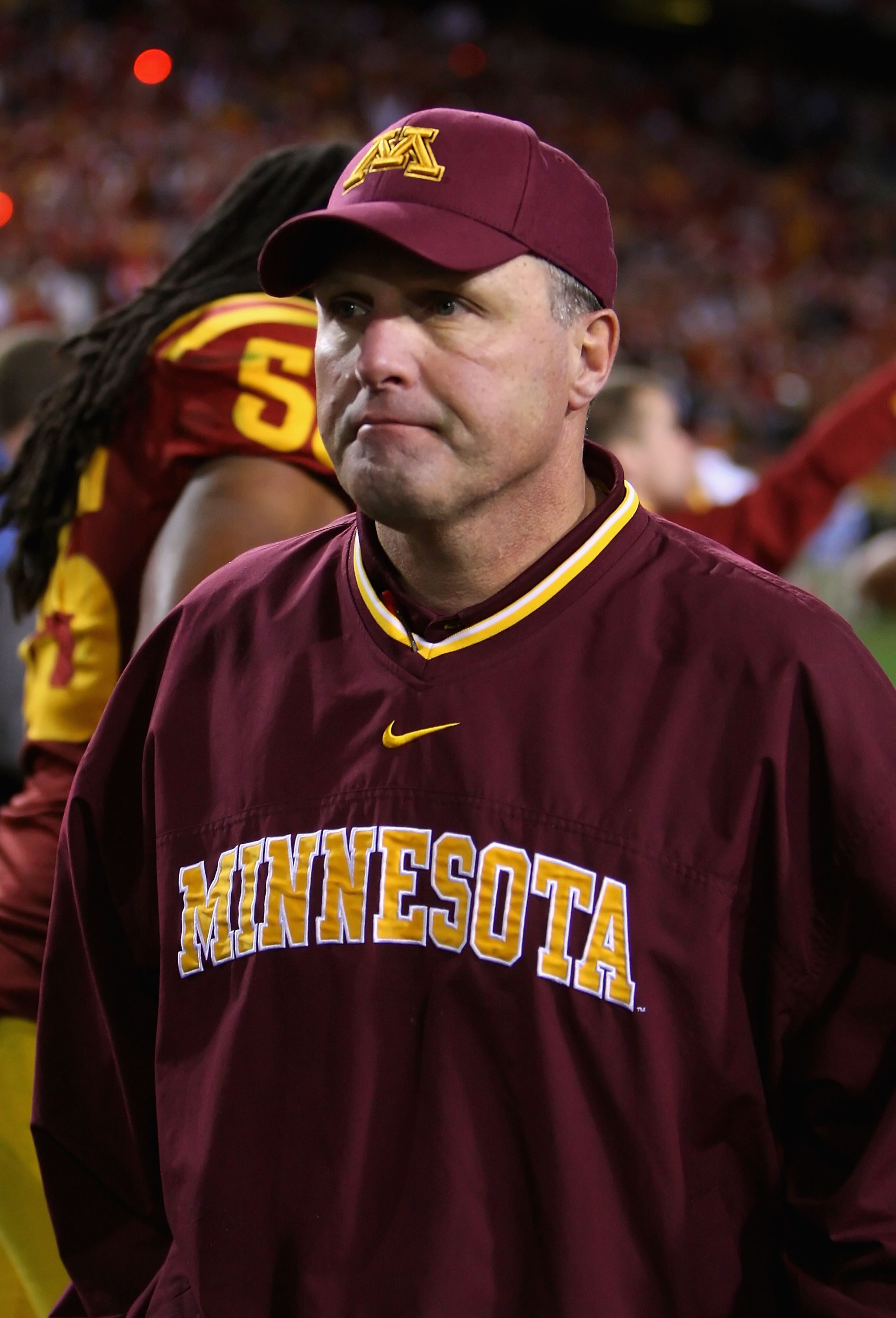 TEMPE, AZ - DECEMBER 31: Head coach Tim Brewster of the Minnesota Golden Gophers walks off the field after being defeated by the Iowa State Cyclones in the Insight Bowl at Arizona Stadium on December 31, 2009 in Tempe, Arizona. The Cyclones defeated the TEMPE, AZ - DECEMBER 31: Head coach Tim Brewster of the Minnesota Golden Gophers walks off the field after being defeated by the Iowa State Cyclones in the Insight Bowl at Arizona Stadium on December 31, 2009 in Tempe, Arizona. The Cyclones defeated the