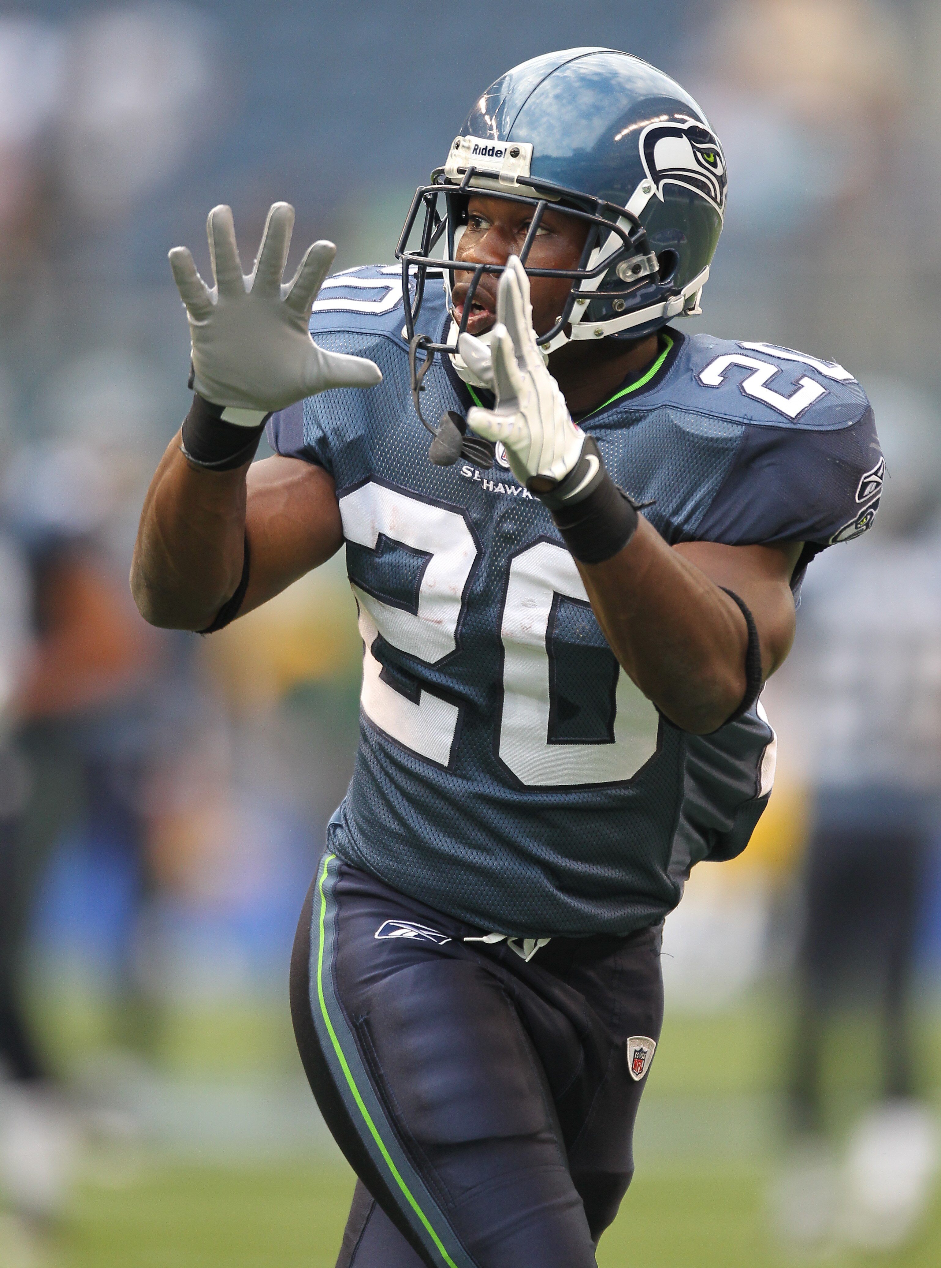 SEATTLE - AUGUST 21:  Running back Justin Forsett #20 of the Seattle Seahawks makes a catch during warmups prior to the preseason game against the Green Bay Packers at Qwest Field on August 21, 2010 in Seattle, Washington. (Photo by Otto Greule Jr/Getty I