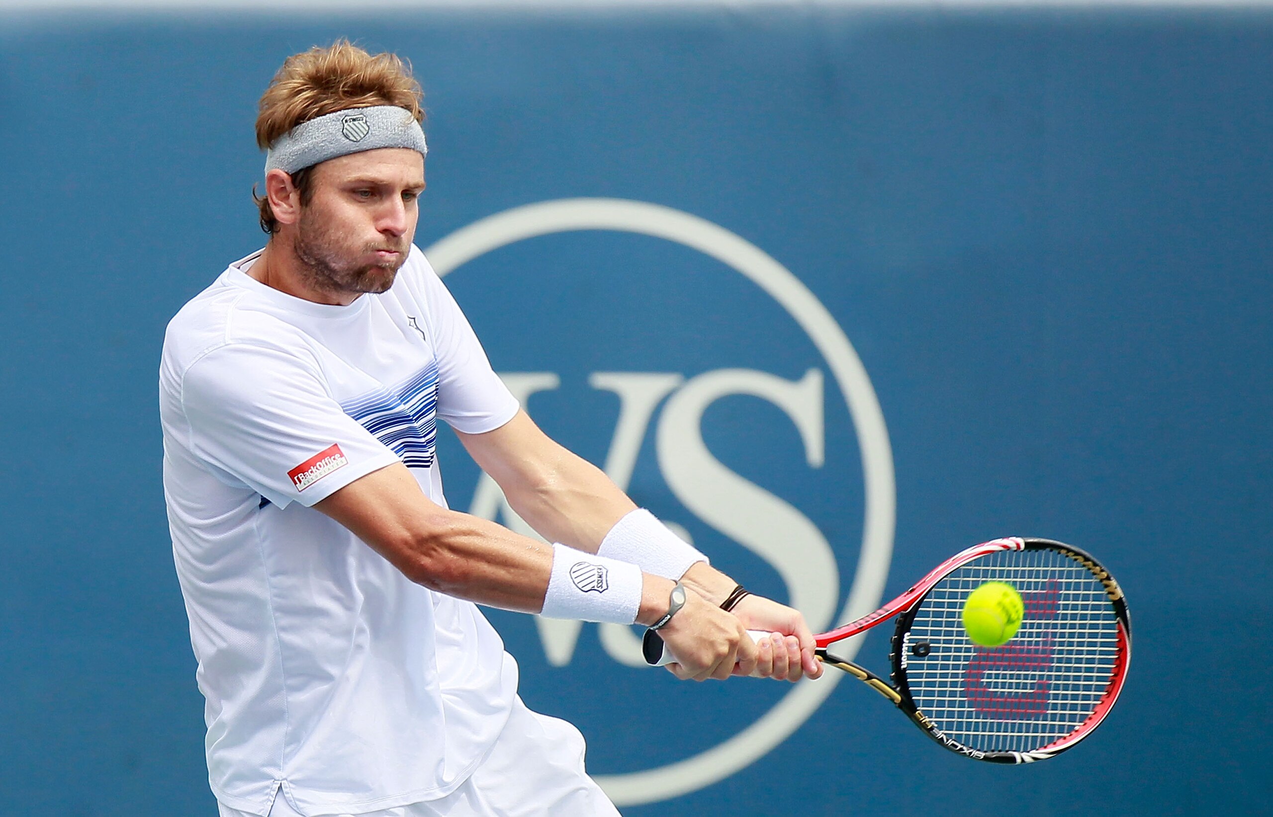 CINCINNATI - AUGUST 22:  Mardy Fish returns a backhand to Roger Federer of Switzerland during the finals on Day 7 of the Western & Southern Financial Group Masters at the Lindner Family Tennis Center on August 22, 2010 in Cincinnati, Ohio.  (Photo by Kevi
