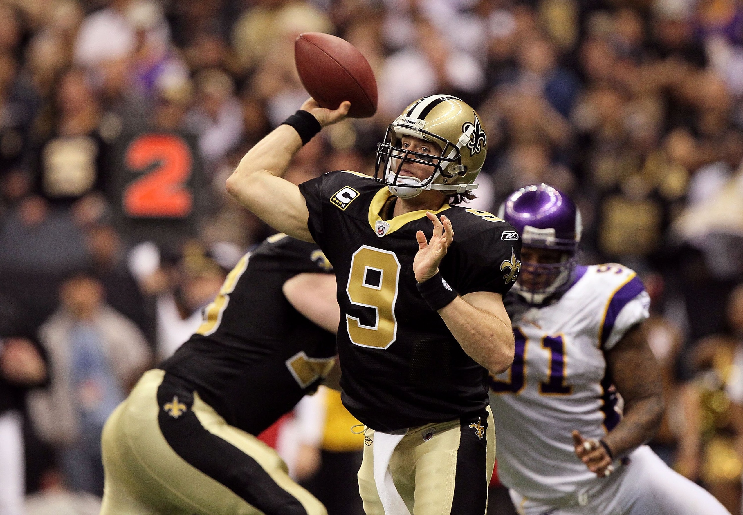 NEW ORLEANS - JANUARY 24:  Drew Brees #9 of the New Orleans Saints throws a pass against the Minnesota Vikings during the NFC Championship Game at the Louisiana Superdome on January 24, 2010 in New Orleans, Louisiana. The Saints won 31-28 in overtime. (Ph